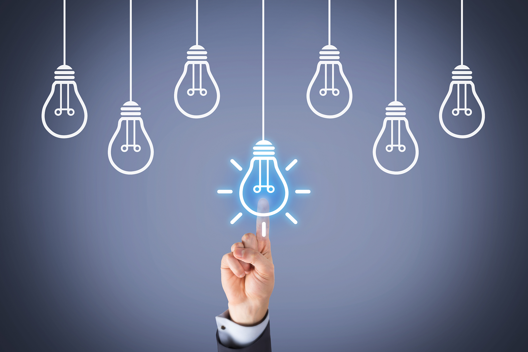 human hand touching idea concepts with light bulbs
