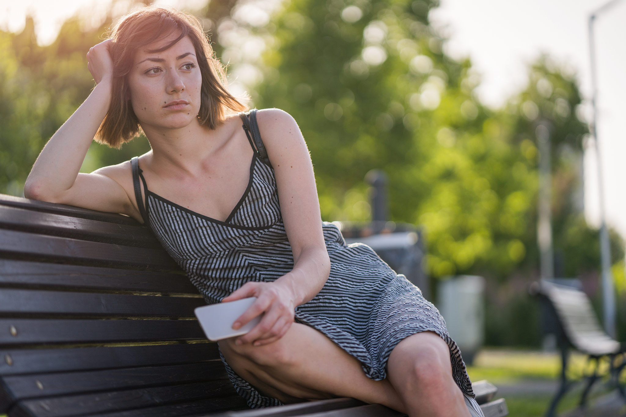 unhappy woman waiting in the park