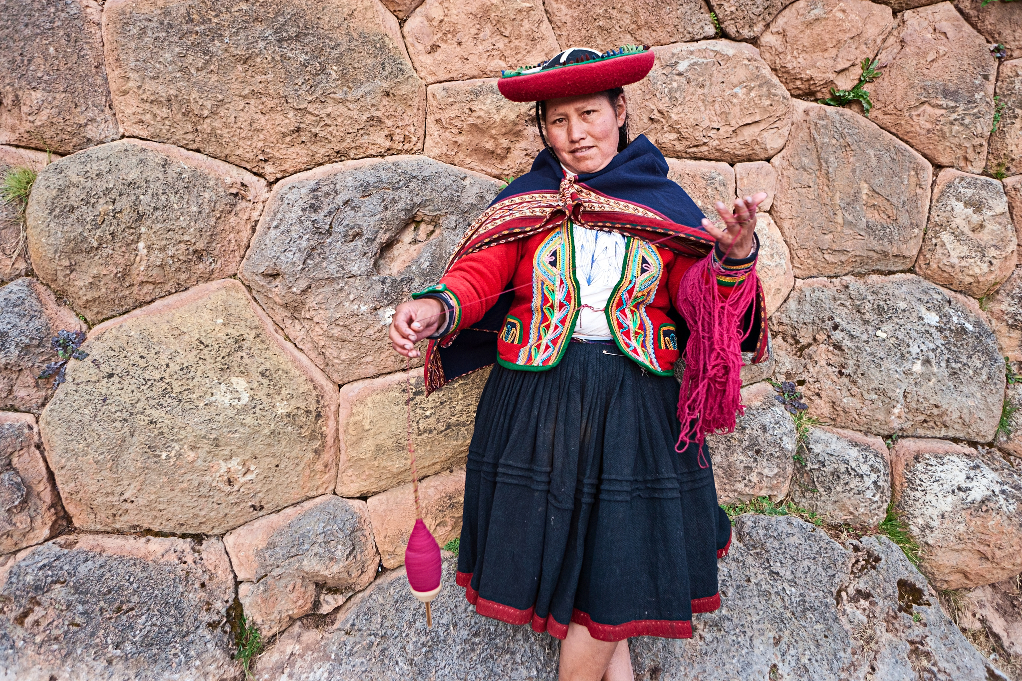 peruvian woman spinning wool, the sacred valley, chinchero