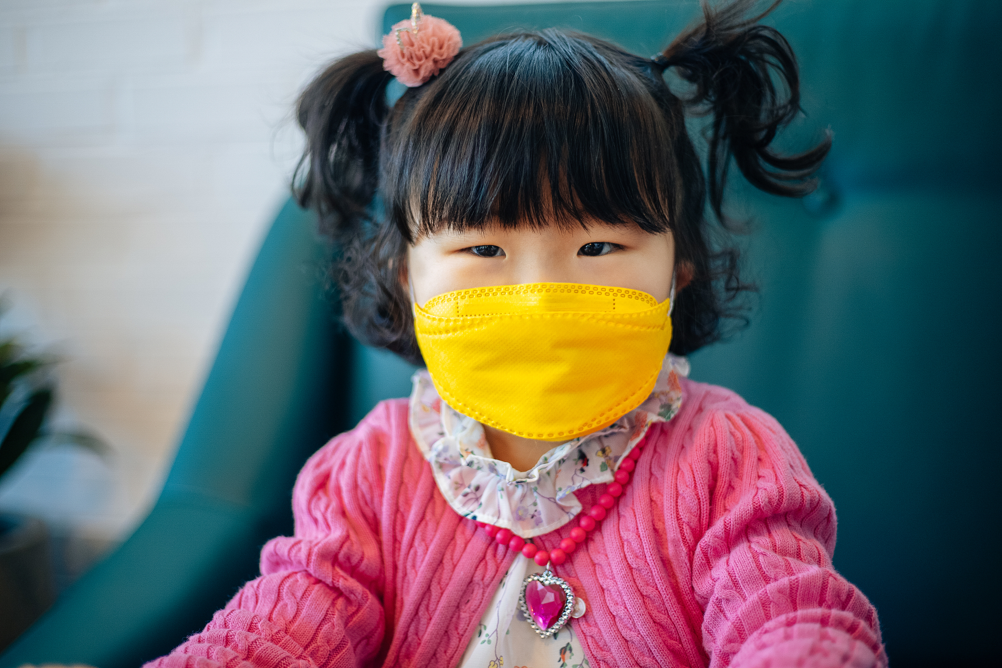 little girl wearing face mask