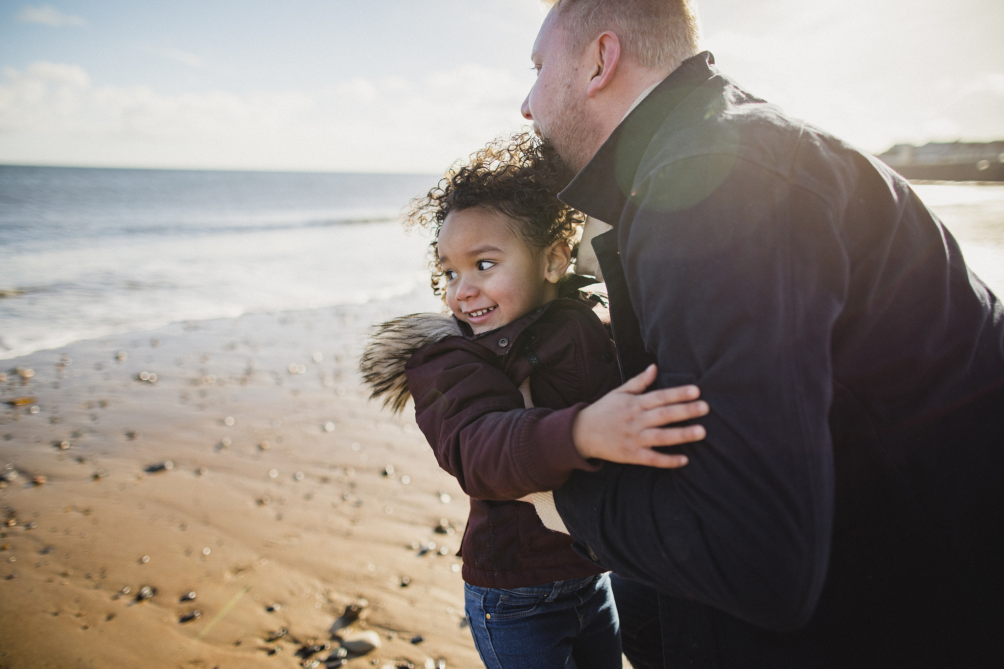 playing on the beach with dad