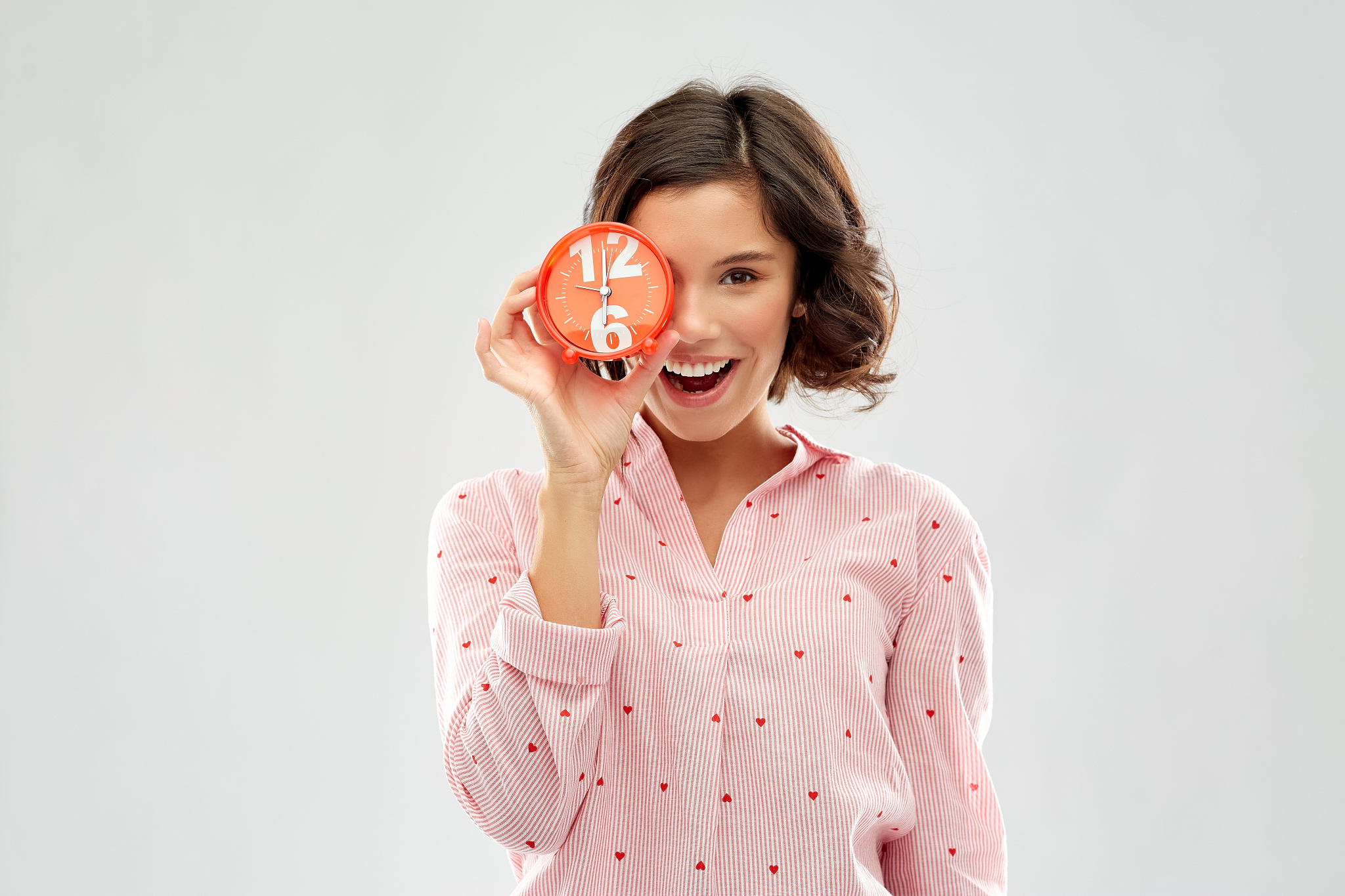 people and bedtime concept - happy young woman in pajama coverin