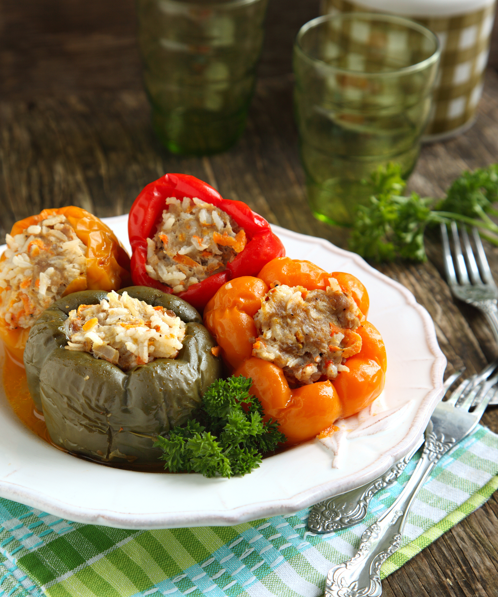 colorful peppers stuffed with meat, rice and vegetables