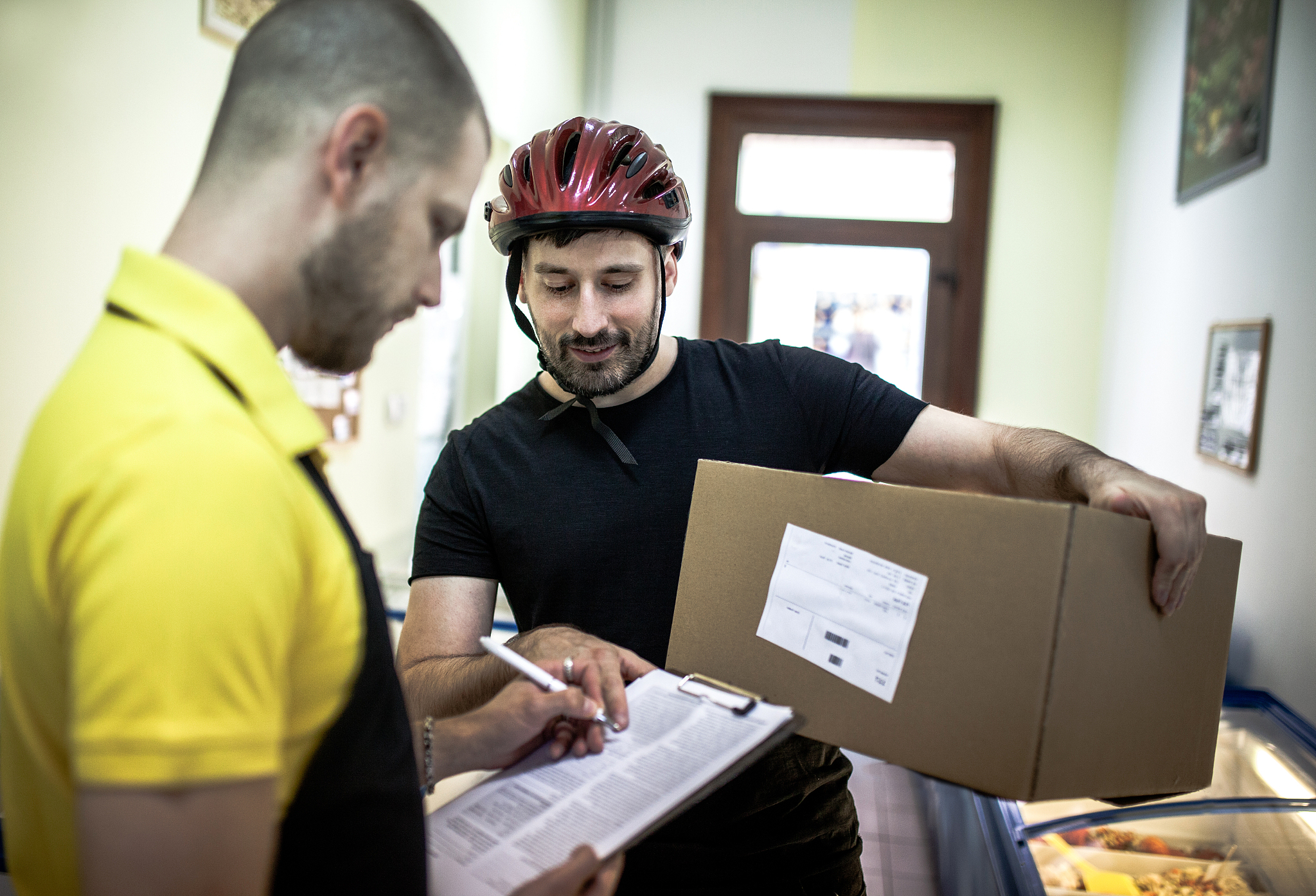 bike courier delivering a package to client