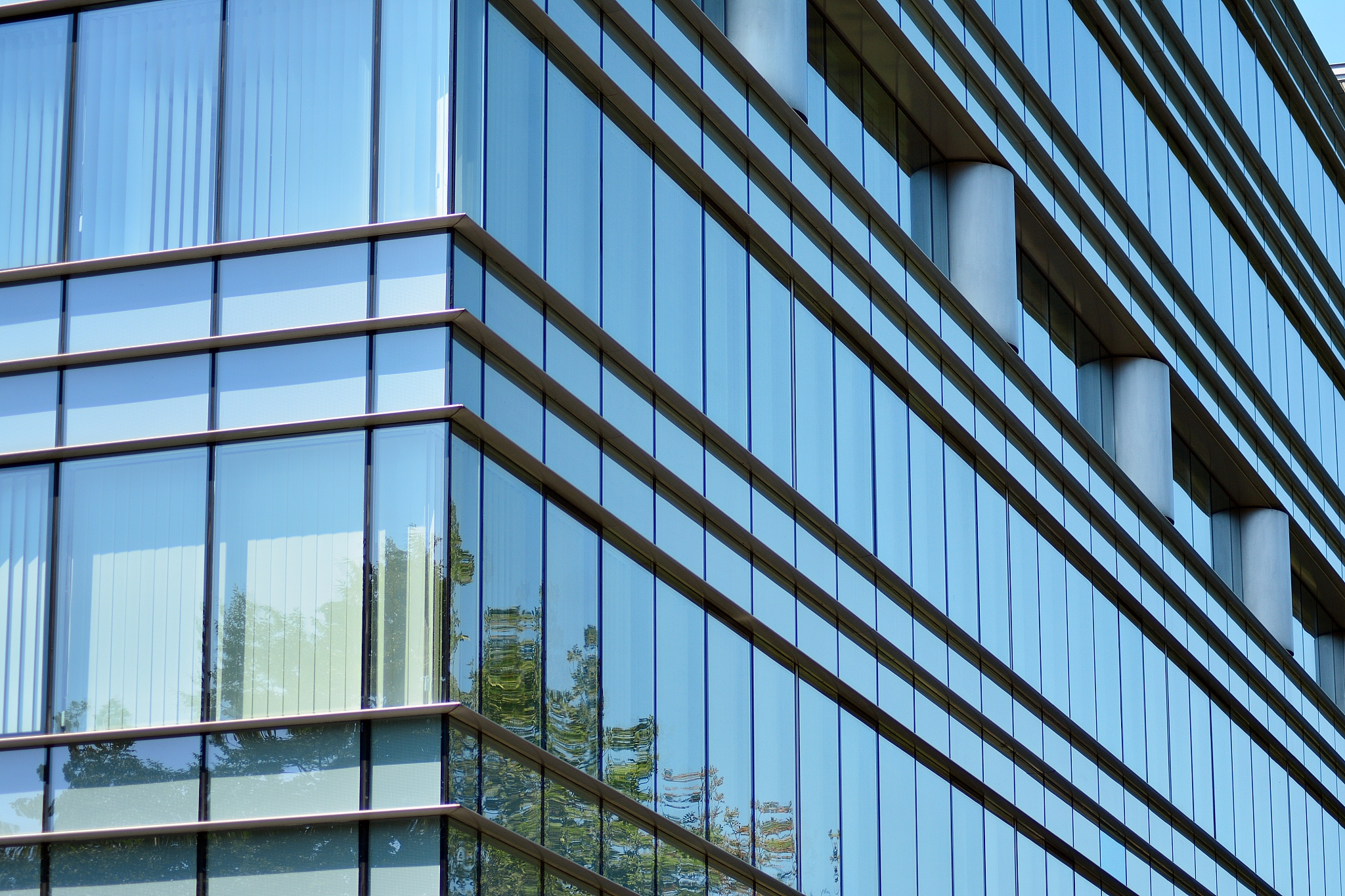 blue clean glass wall of modern office building