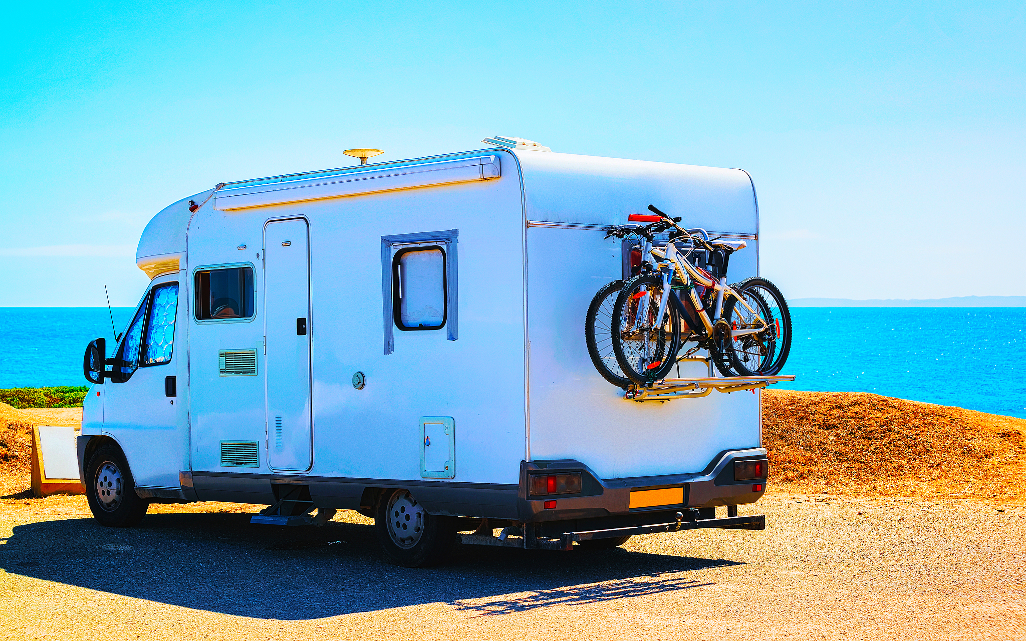 camper with bicycles at capo pecora resort mediterranean sea sar