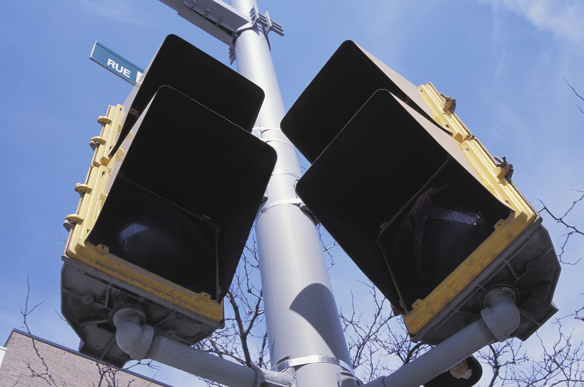 low angle view of crosswalk lights