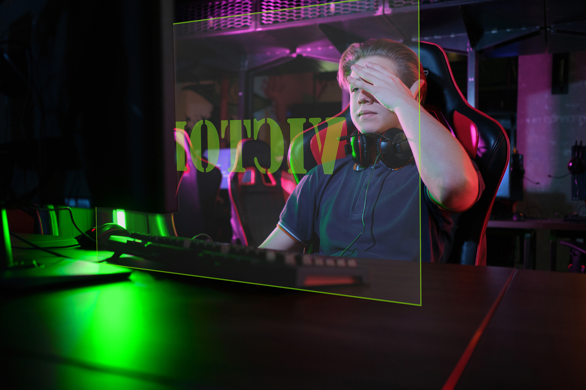 professional young caucasian gamer playing online on his pc. he 