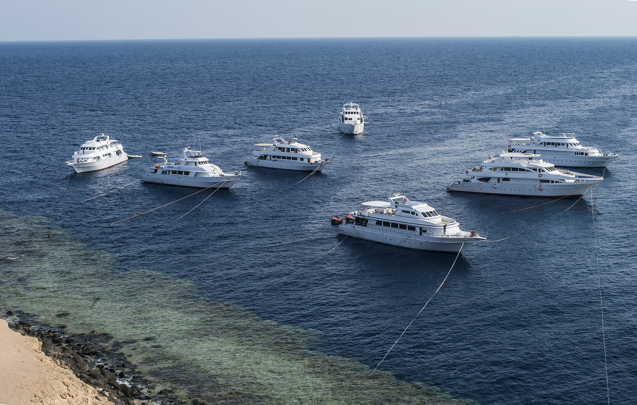 seven moored diver's yachts in the red sea, egypt.