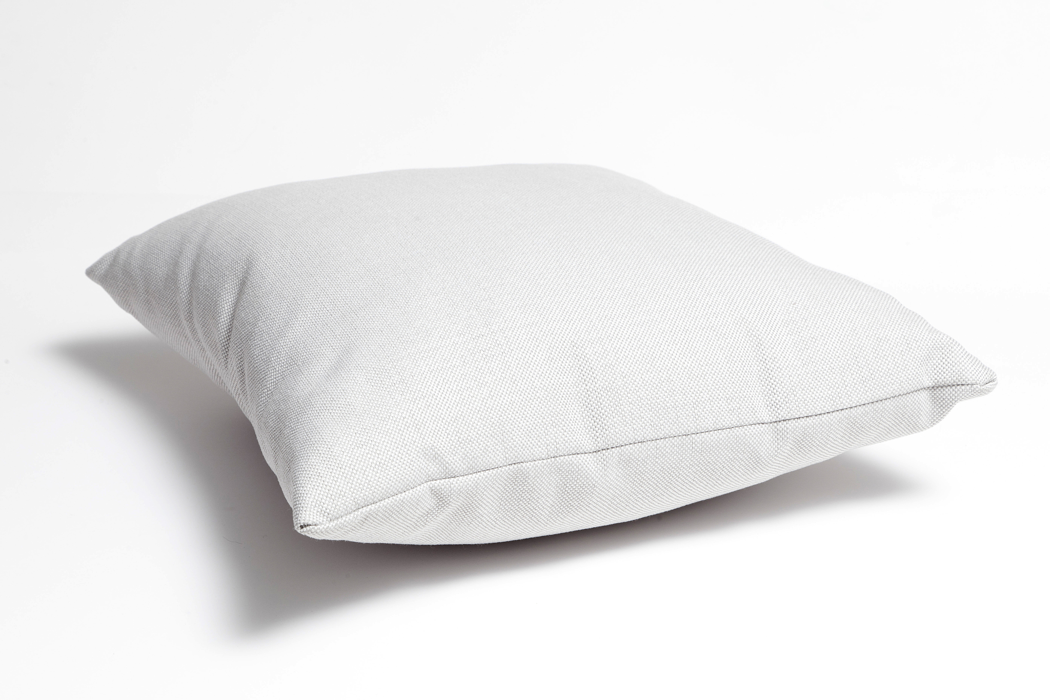 grey pillow on white