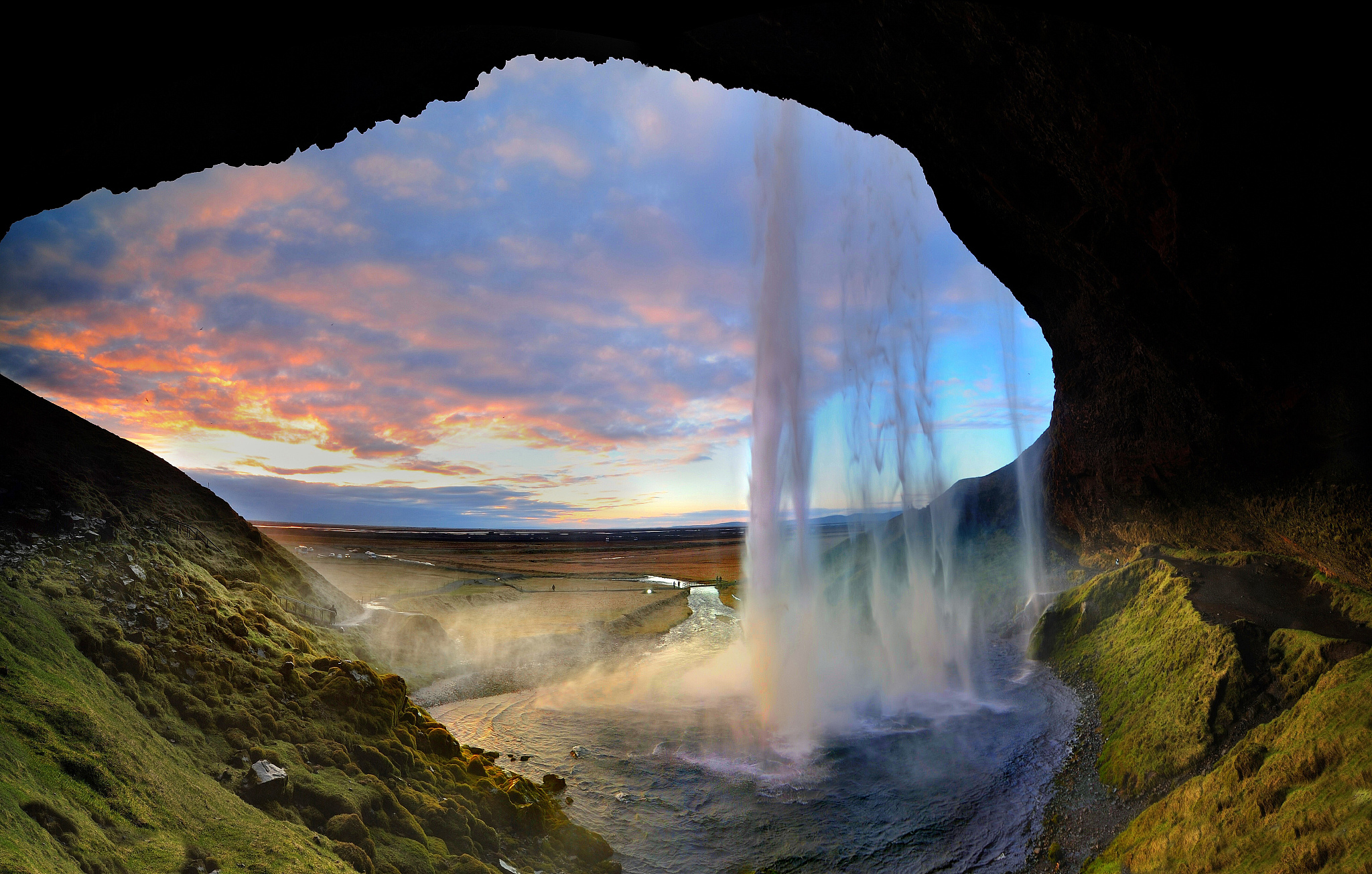 behind the waterfall