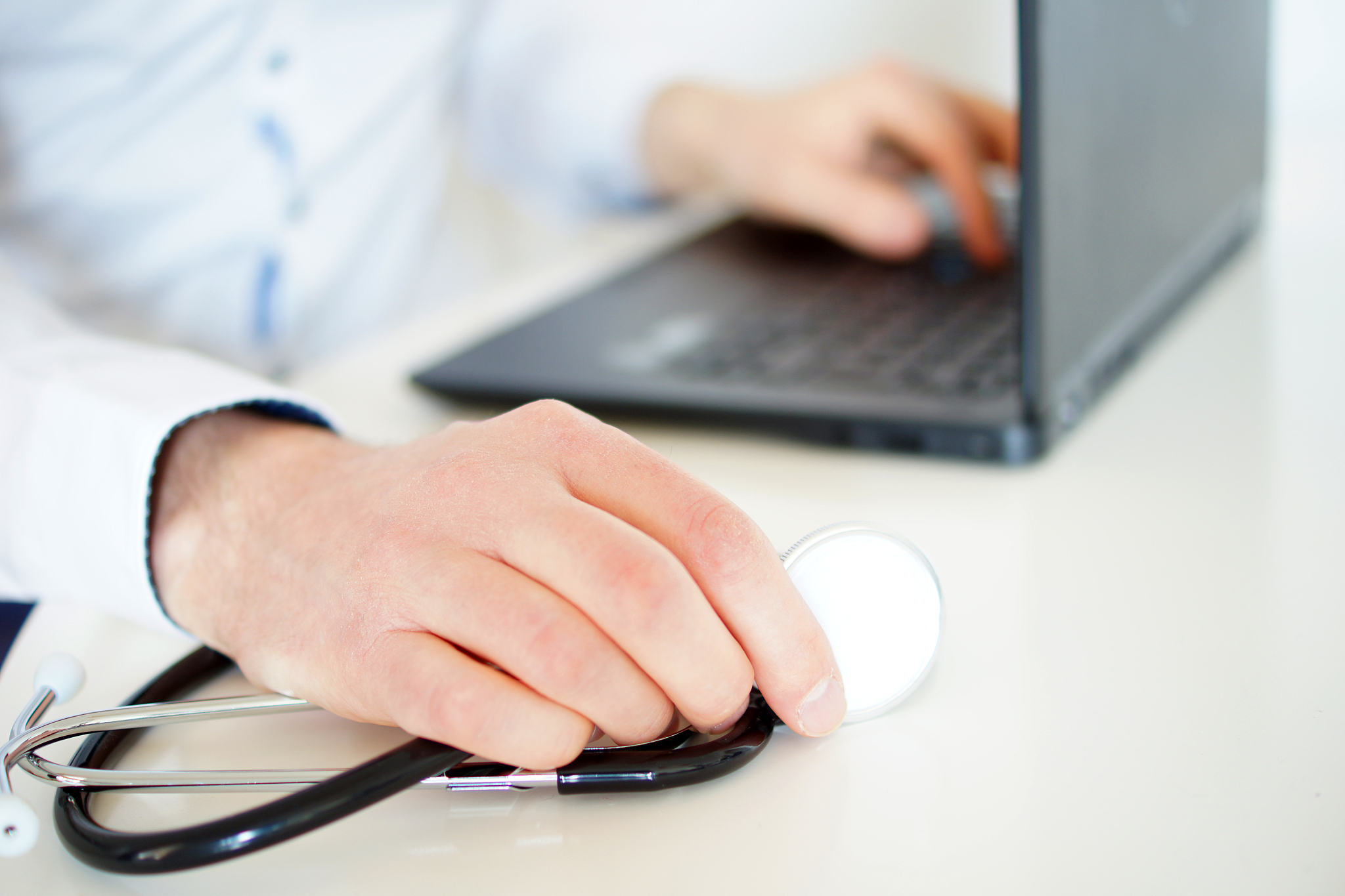 working with laptop computer in the medical workplace office foc