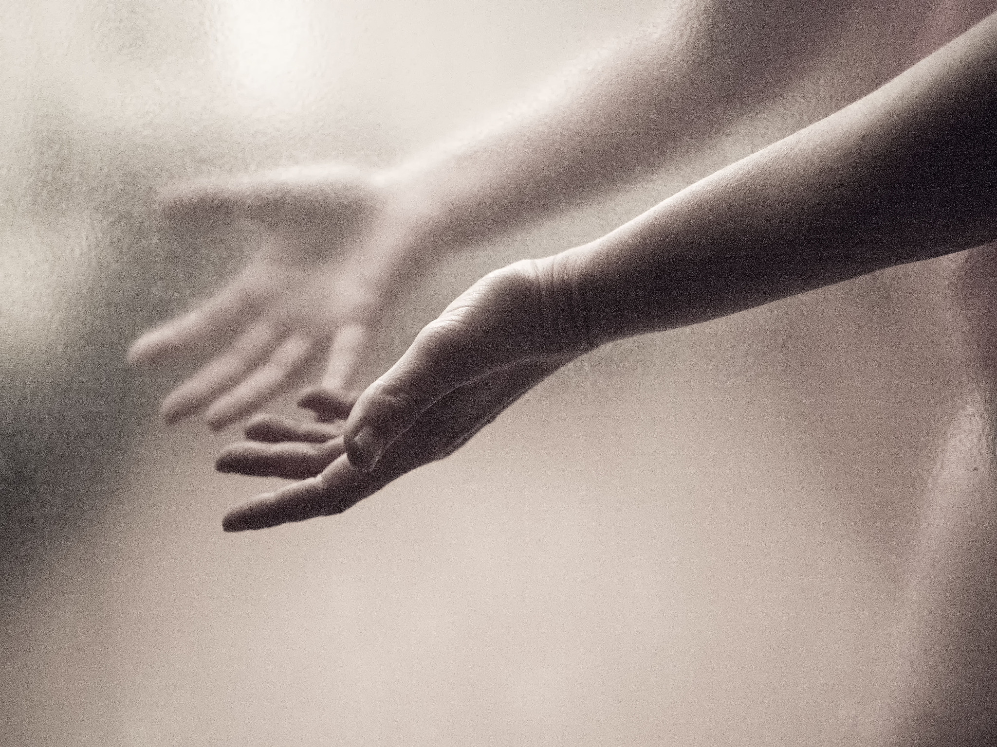 close-up of hand reflecting on mirror