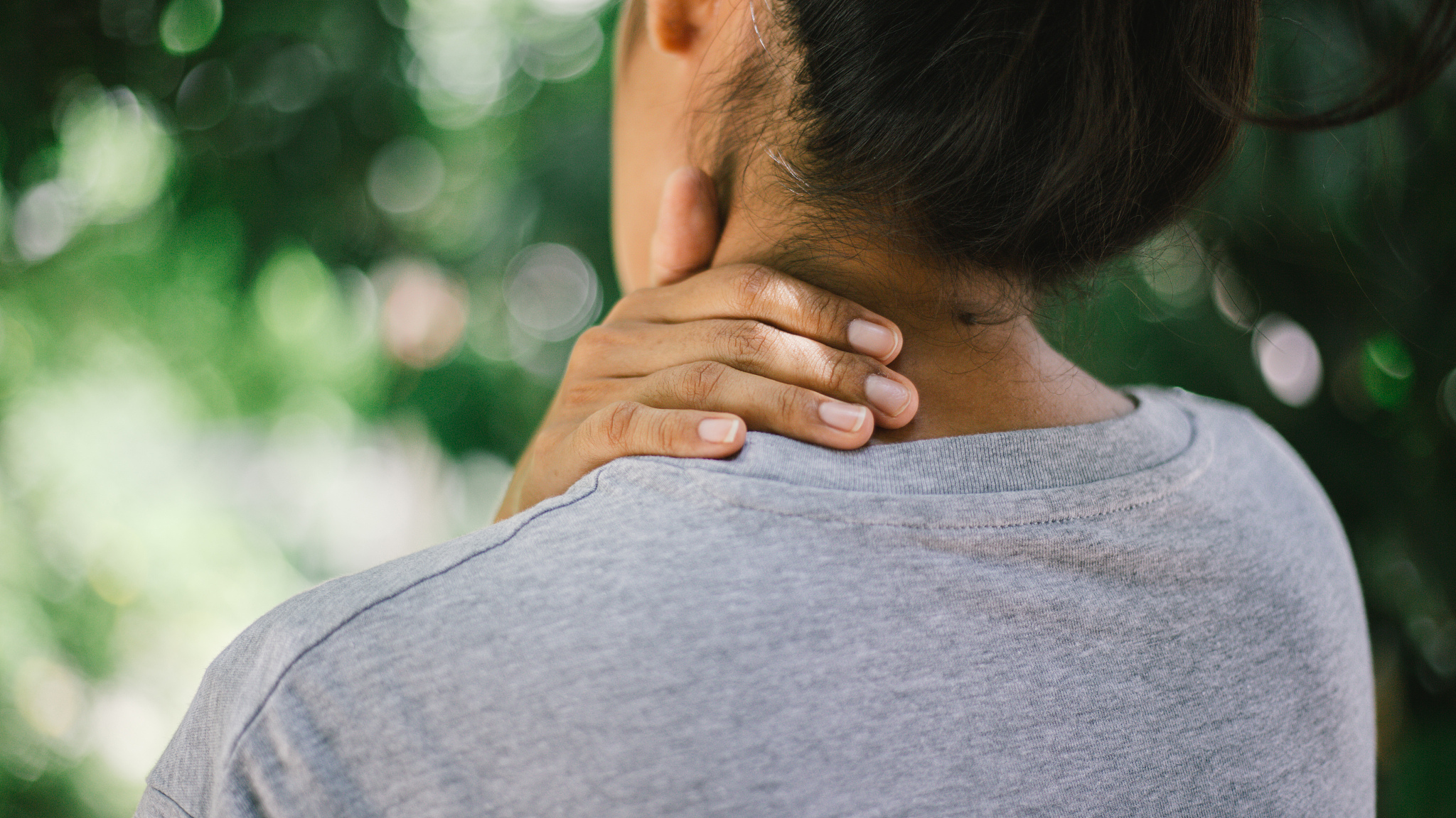 close up young woman neck and shoulder pain and injury, health c