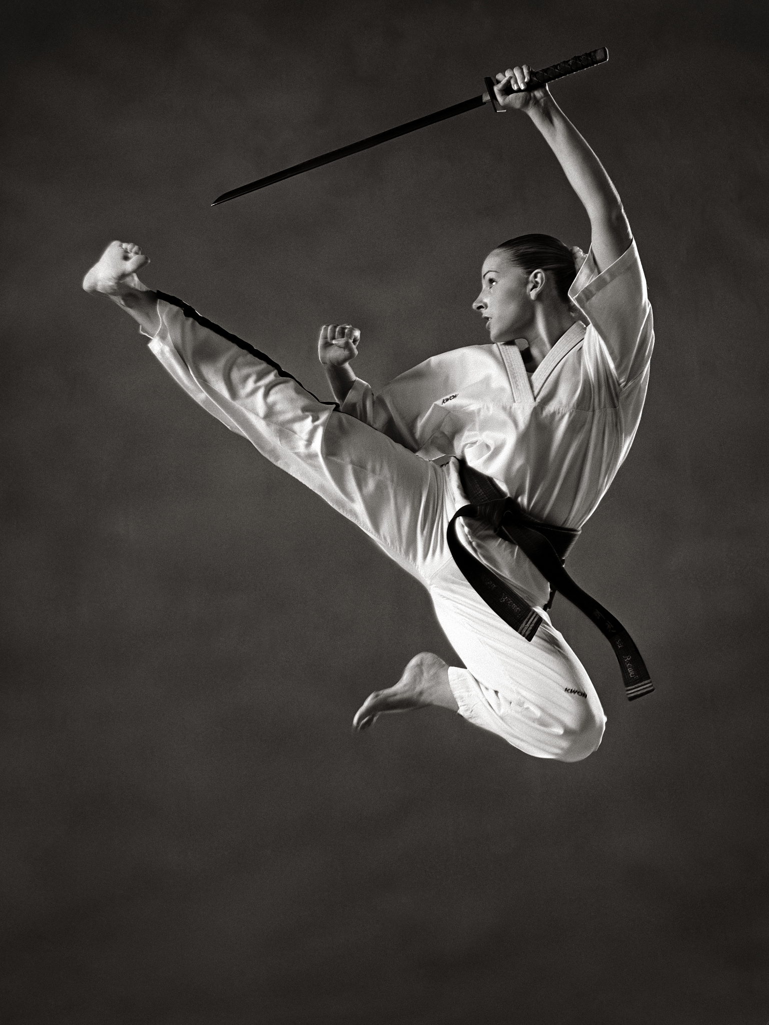 young woman practising martial arts (b&w)