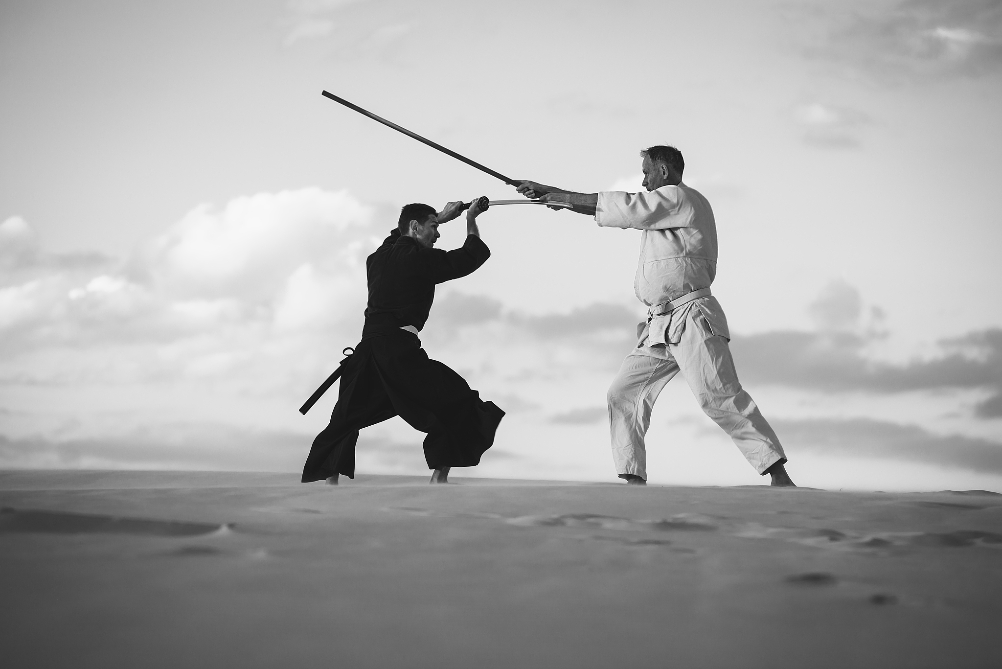concentrated men, in japanese clothes, are practicing martial ar