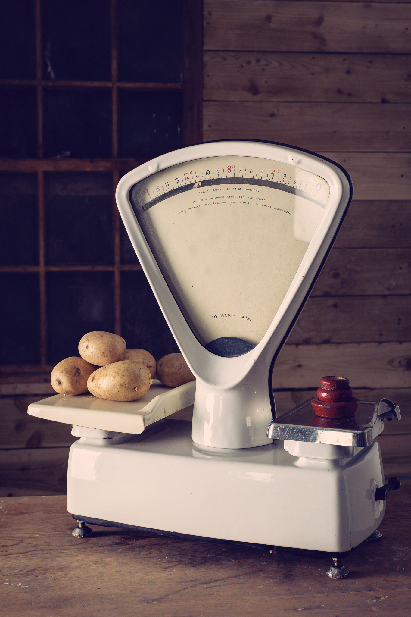 weighing potatoes on vintage scales