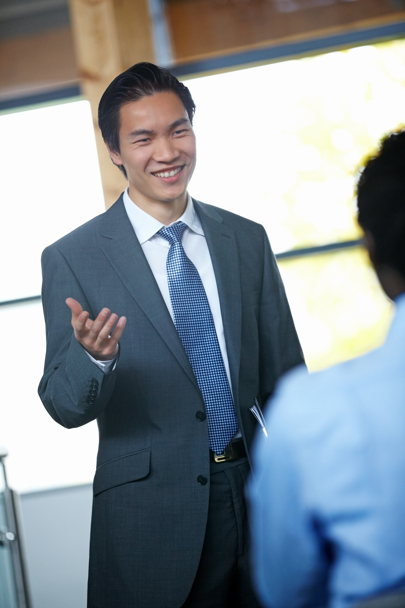 young businessman giving a motivational speech