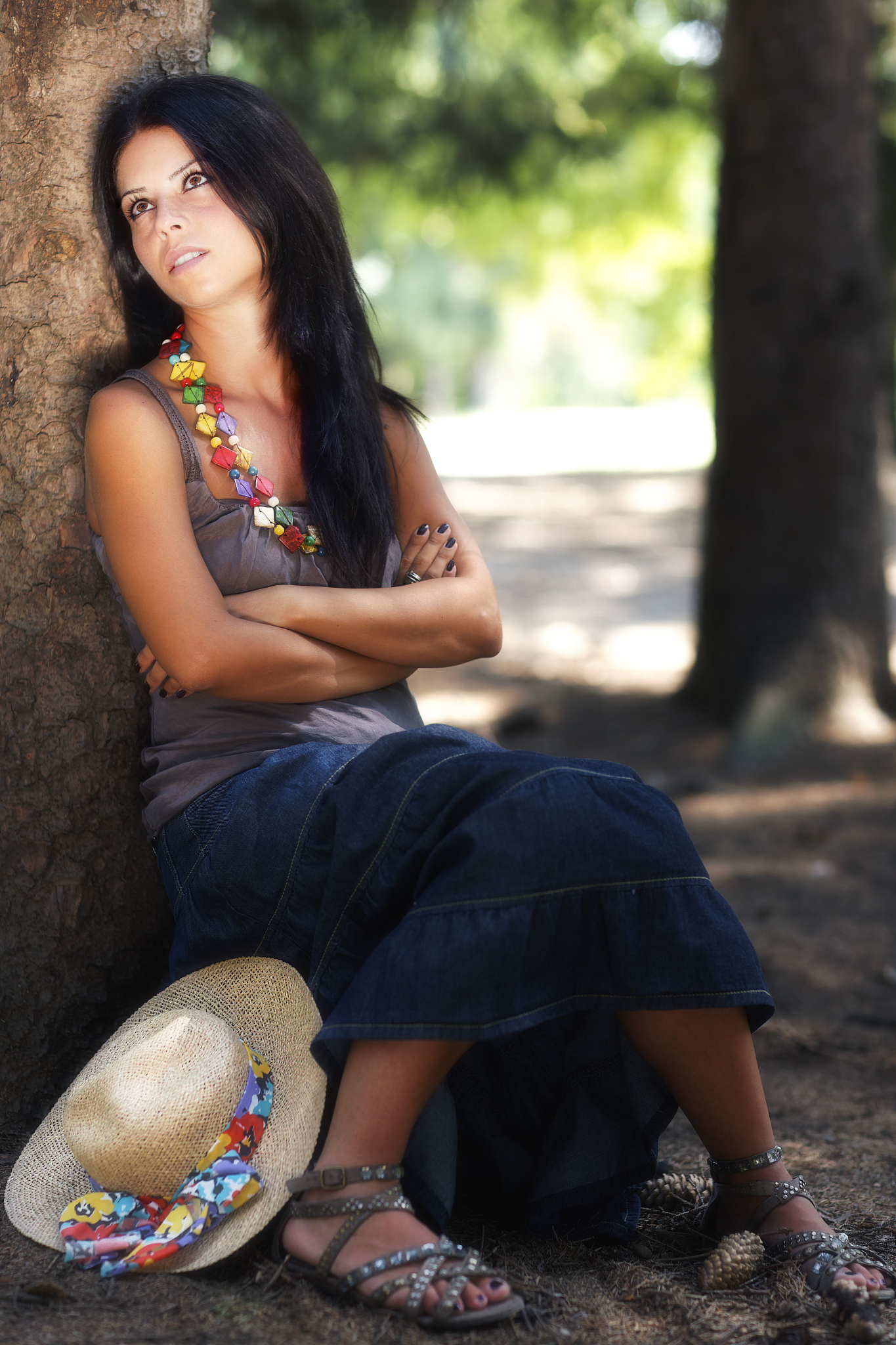 sitting woman in a park. summer. color image