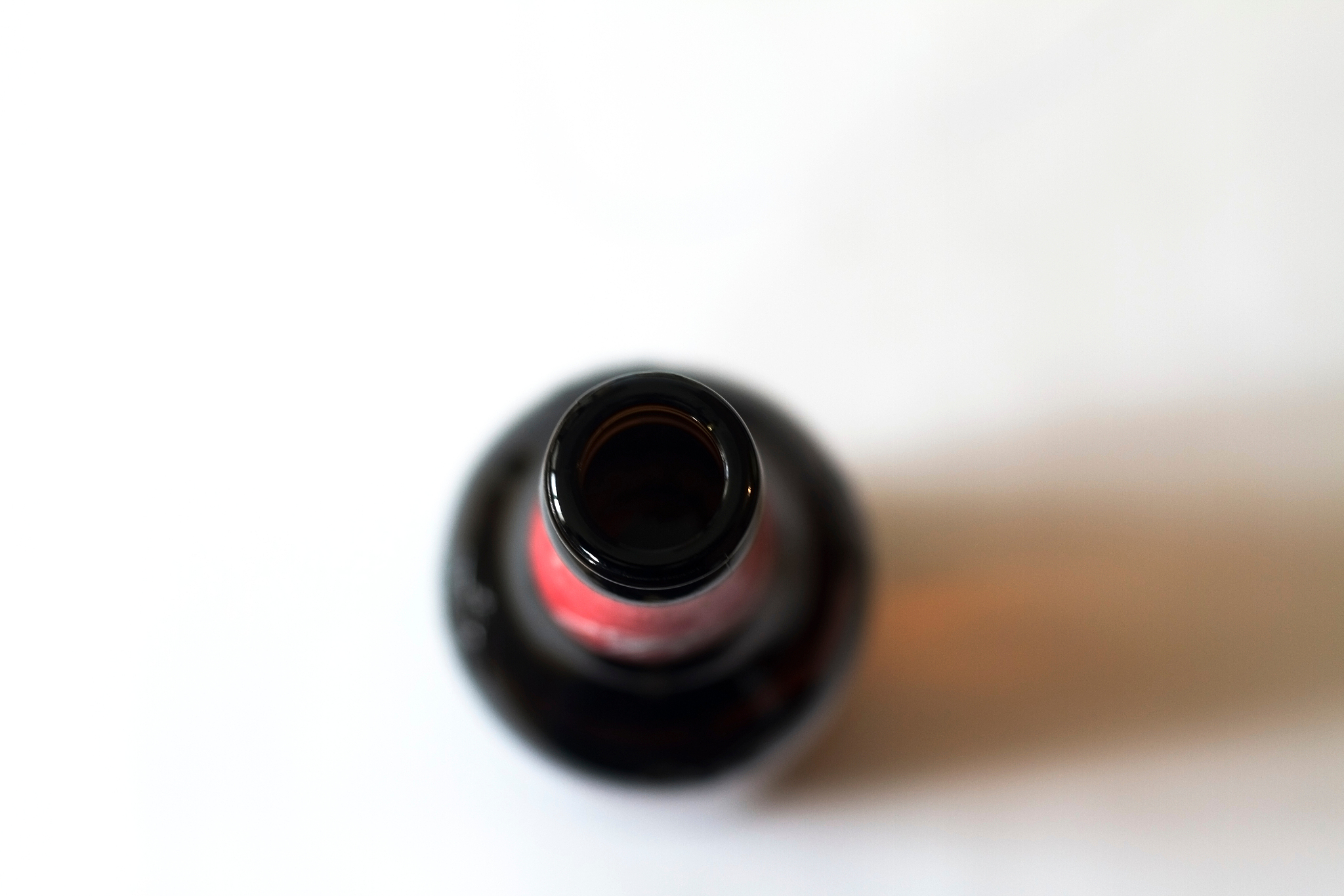 close-up of beer bottle over white background