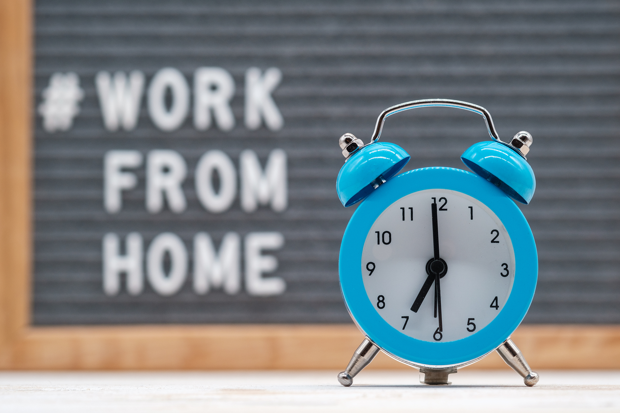 vintage alarm clock on the background of english text work from 
