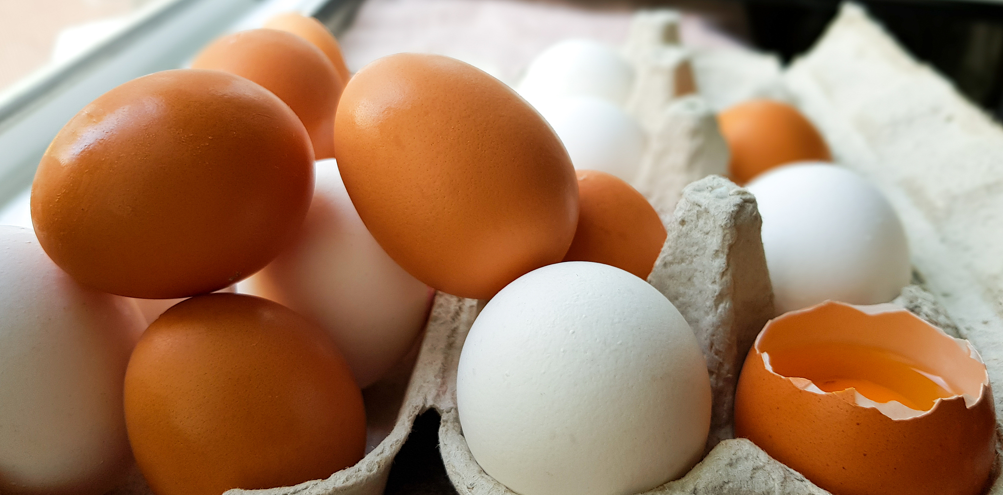 many white and brown eggs are randomly laid