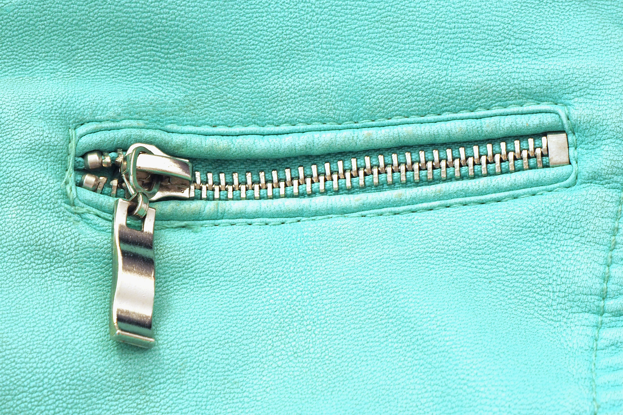 zipped pocket with blue leather jacket