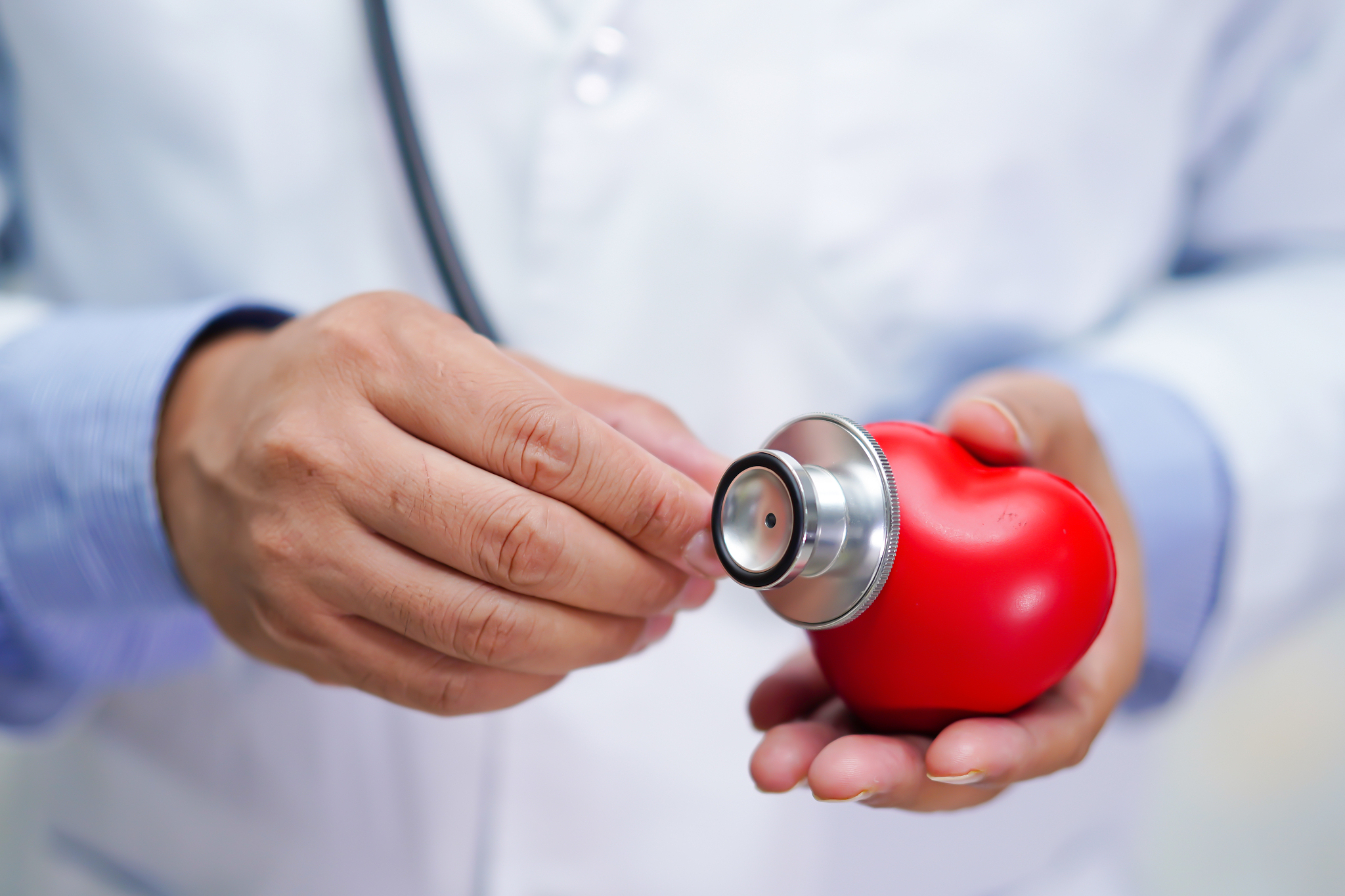 doctor with stethoscope to checking the patient in the hospital 