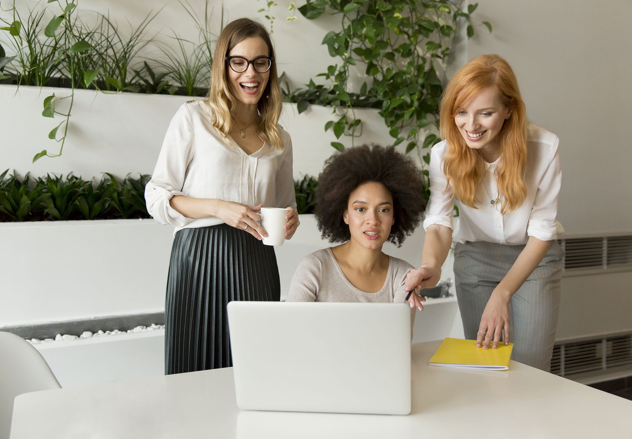 three young businesswomen in the office