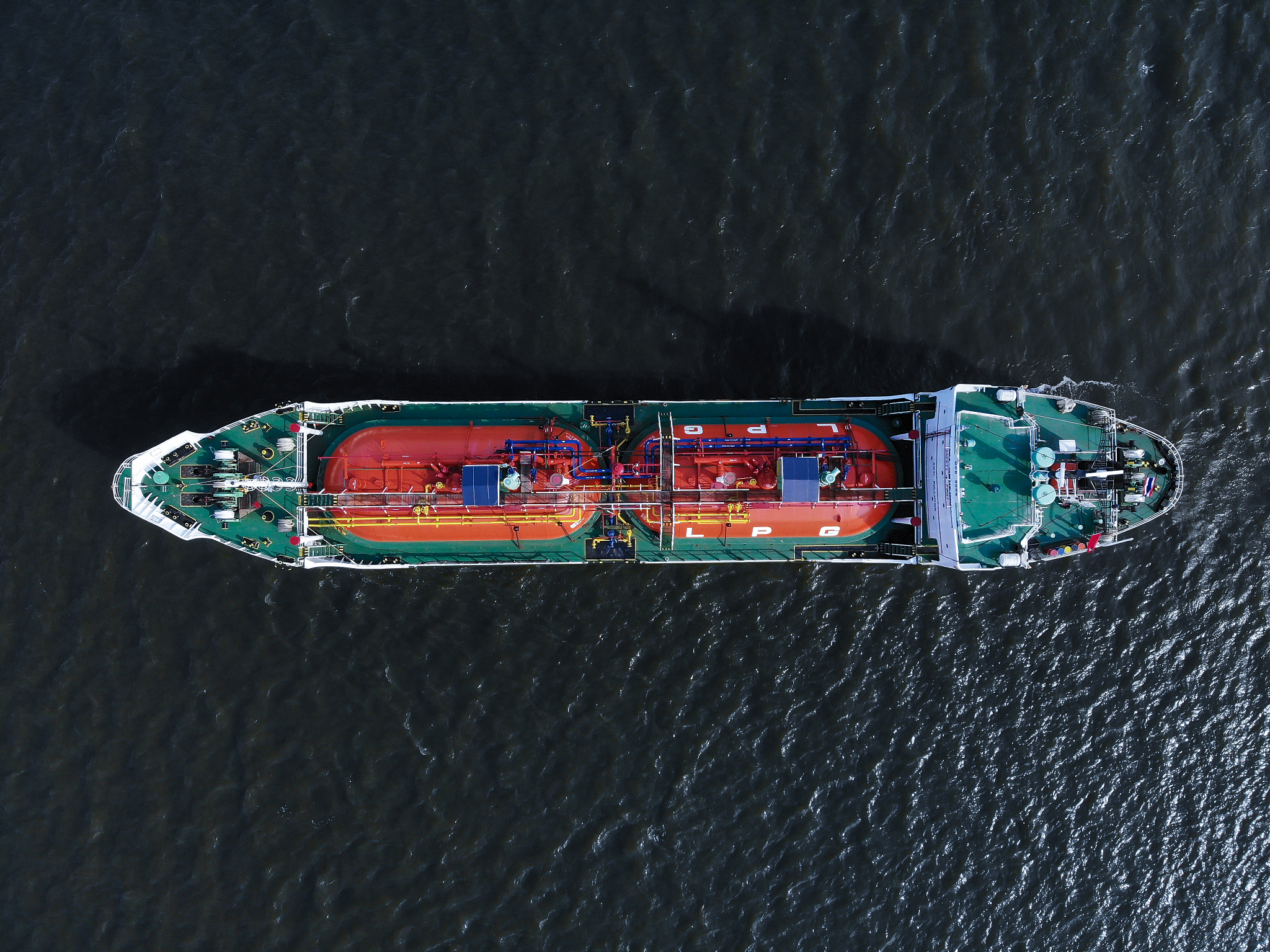 aerial view/lpg gas tankers parked at sea due to the effect of t