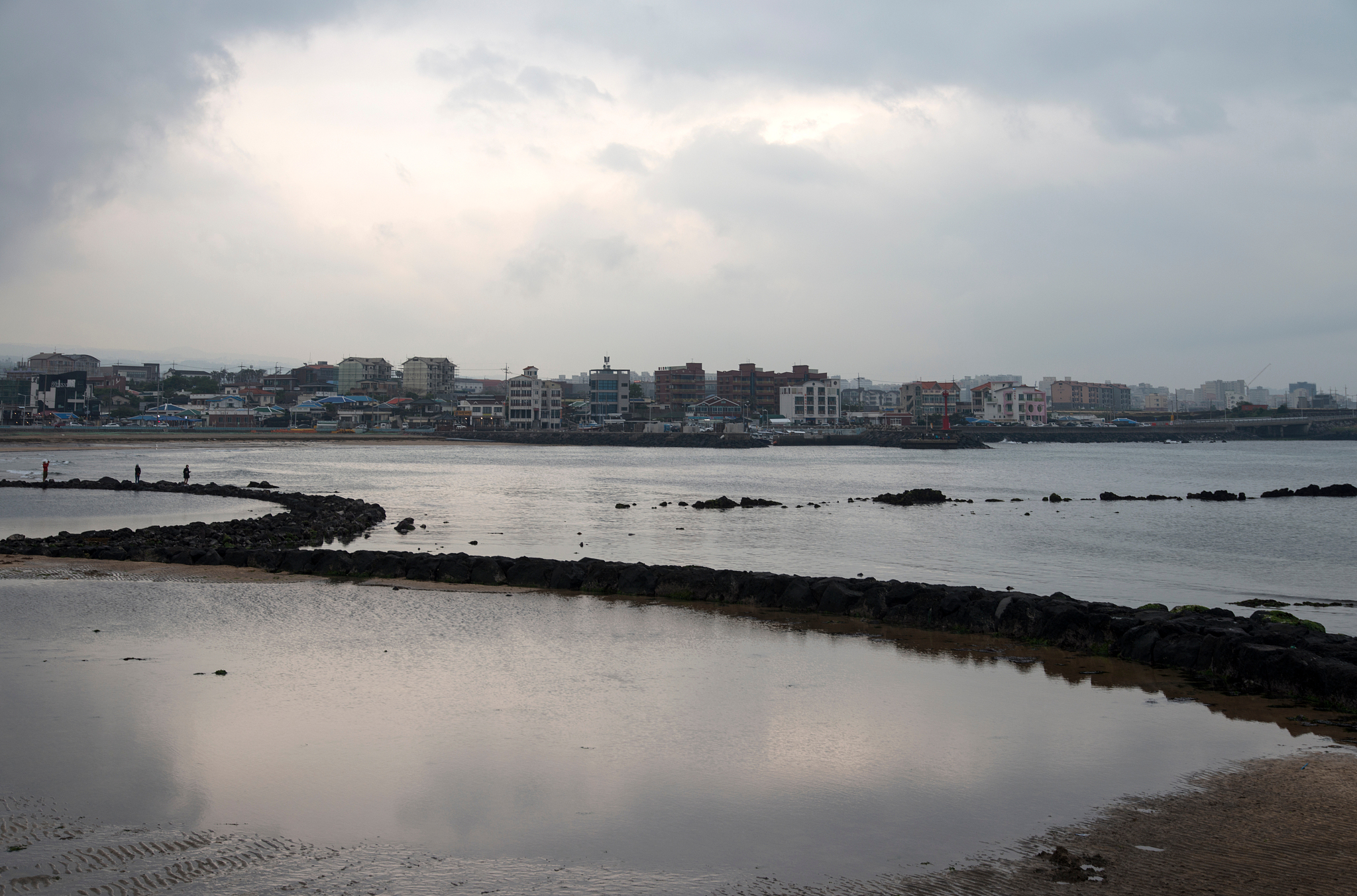 scenic view of sea and cityscape against sky