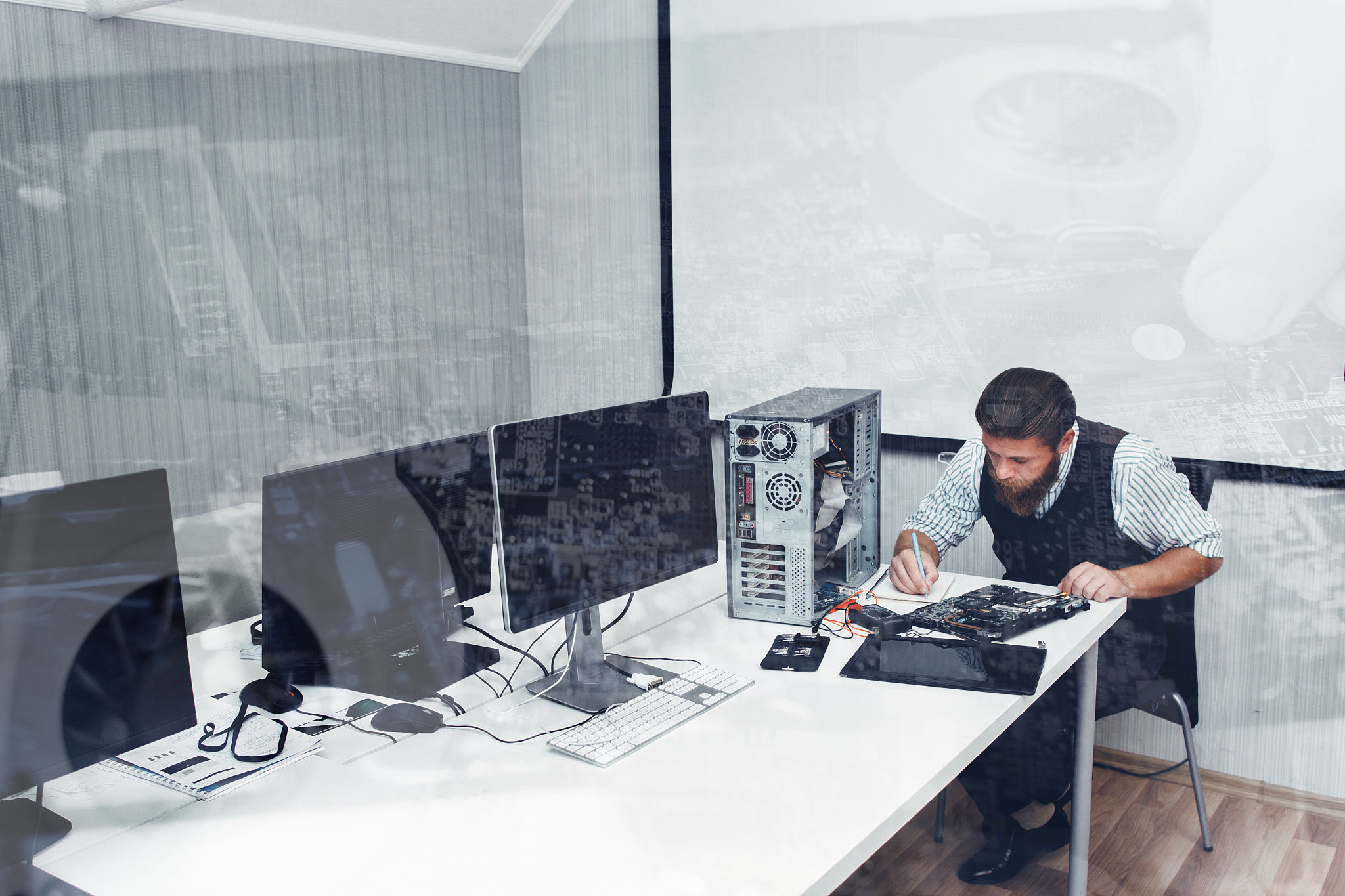 computer repairing at office, double exposure