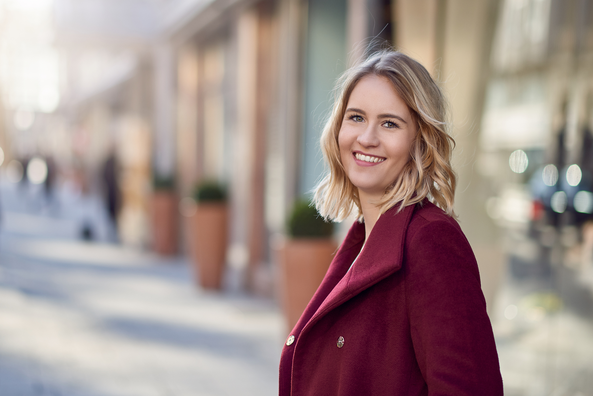 attractive blond woman in a city street