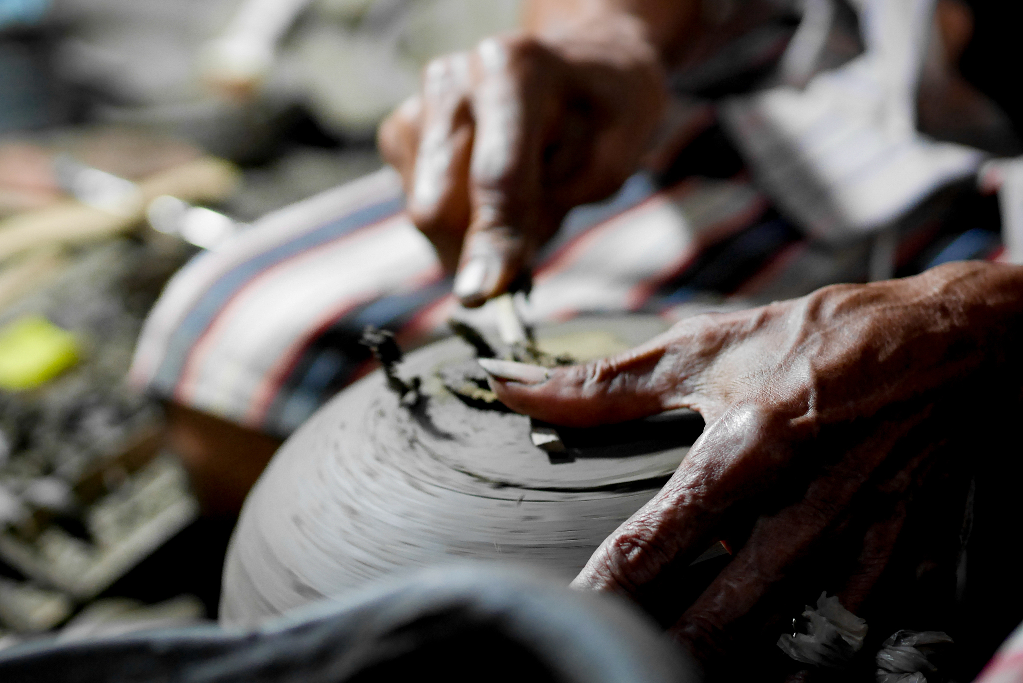 cropped hand of man working in workshop