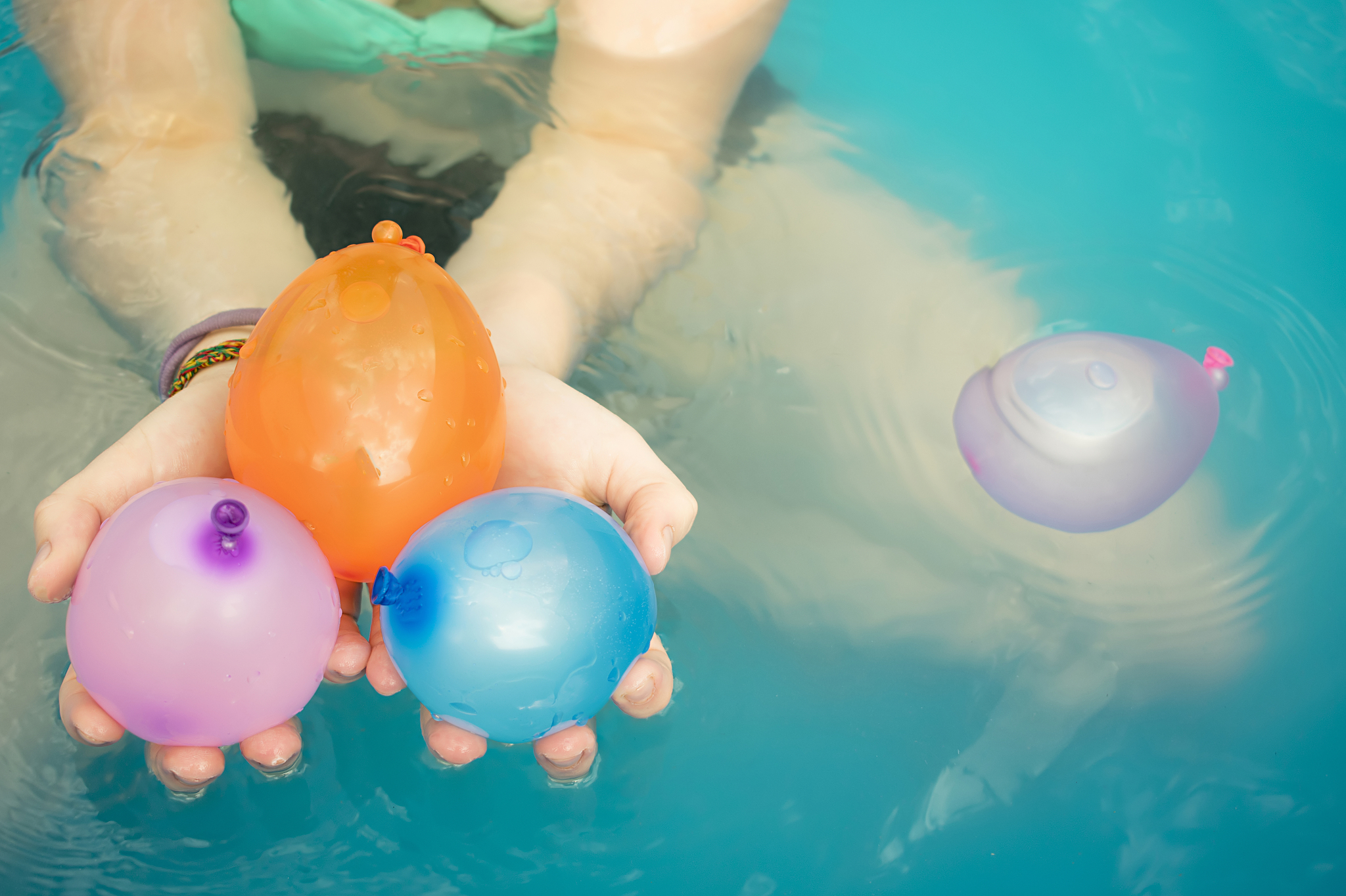 teenager and water balloons.
