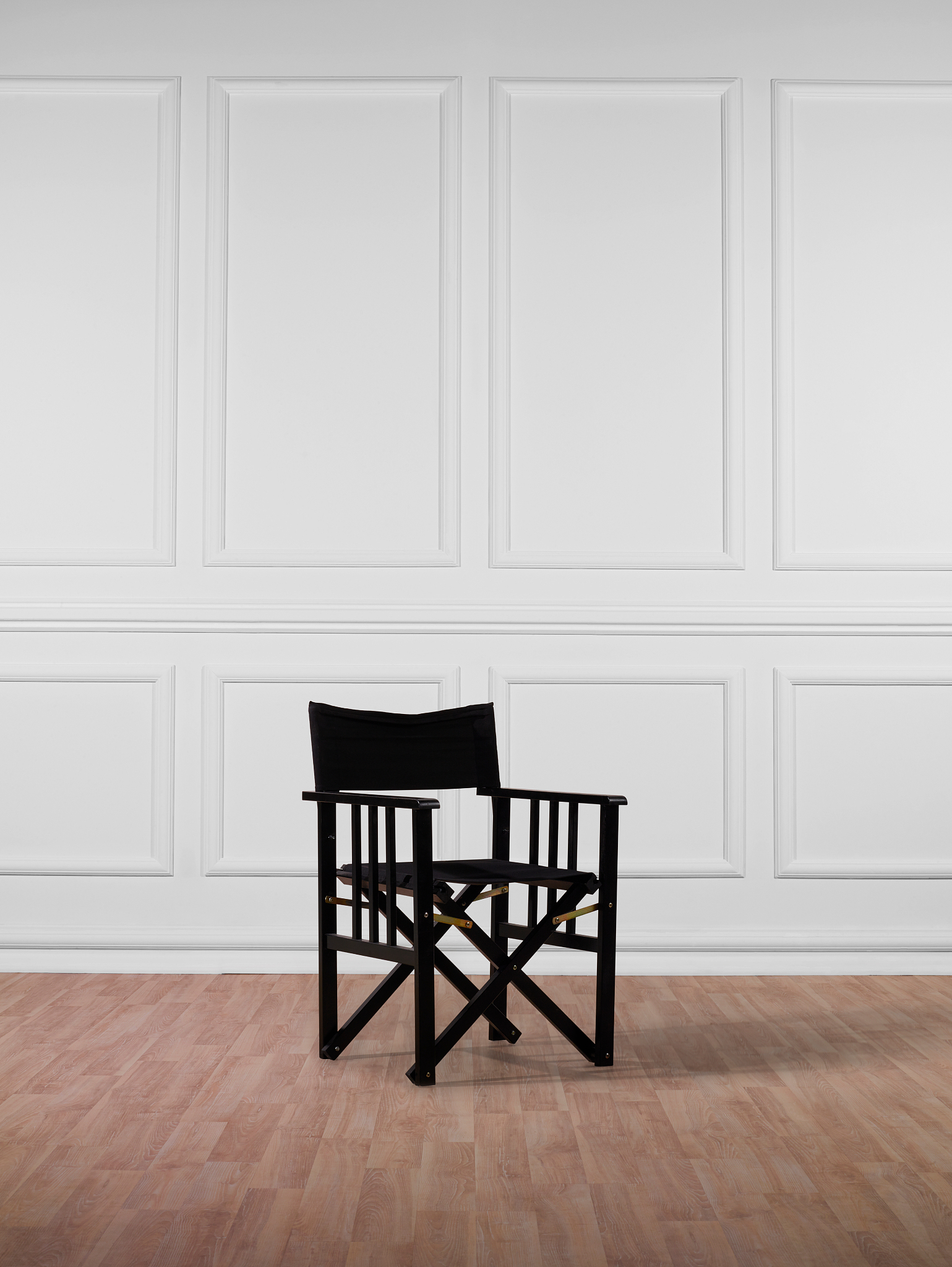 black director chair and white wall