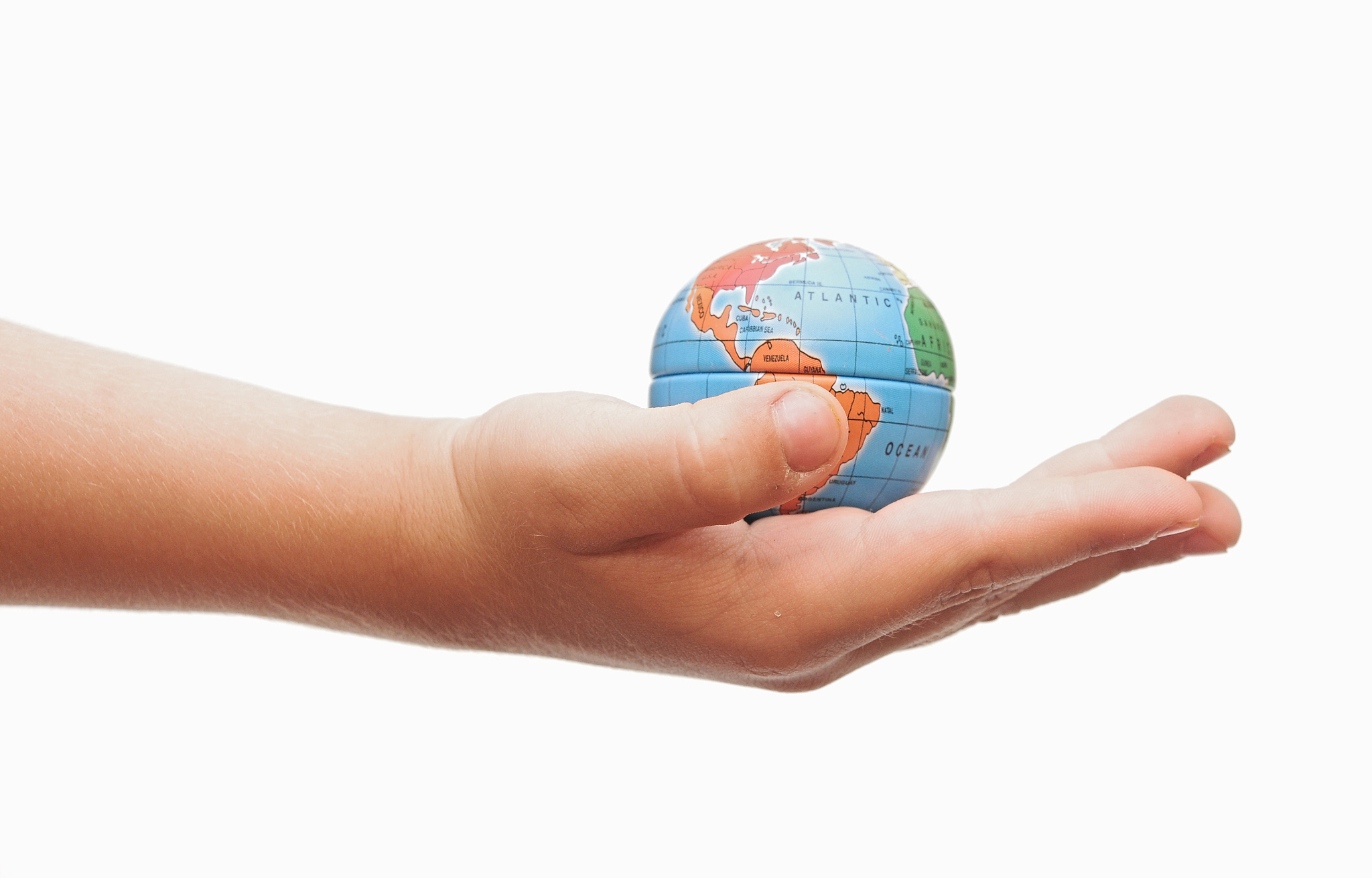 child holding a globe in hand