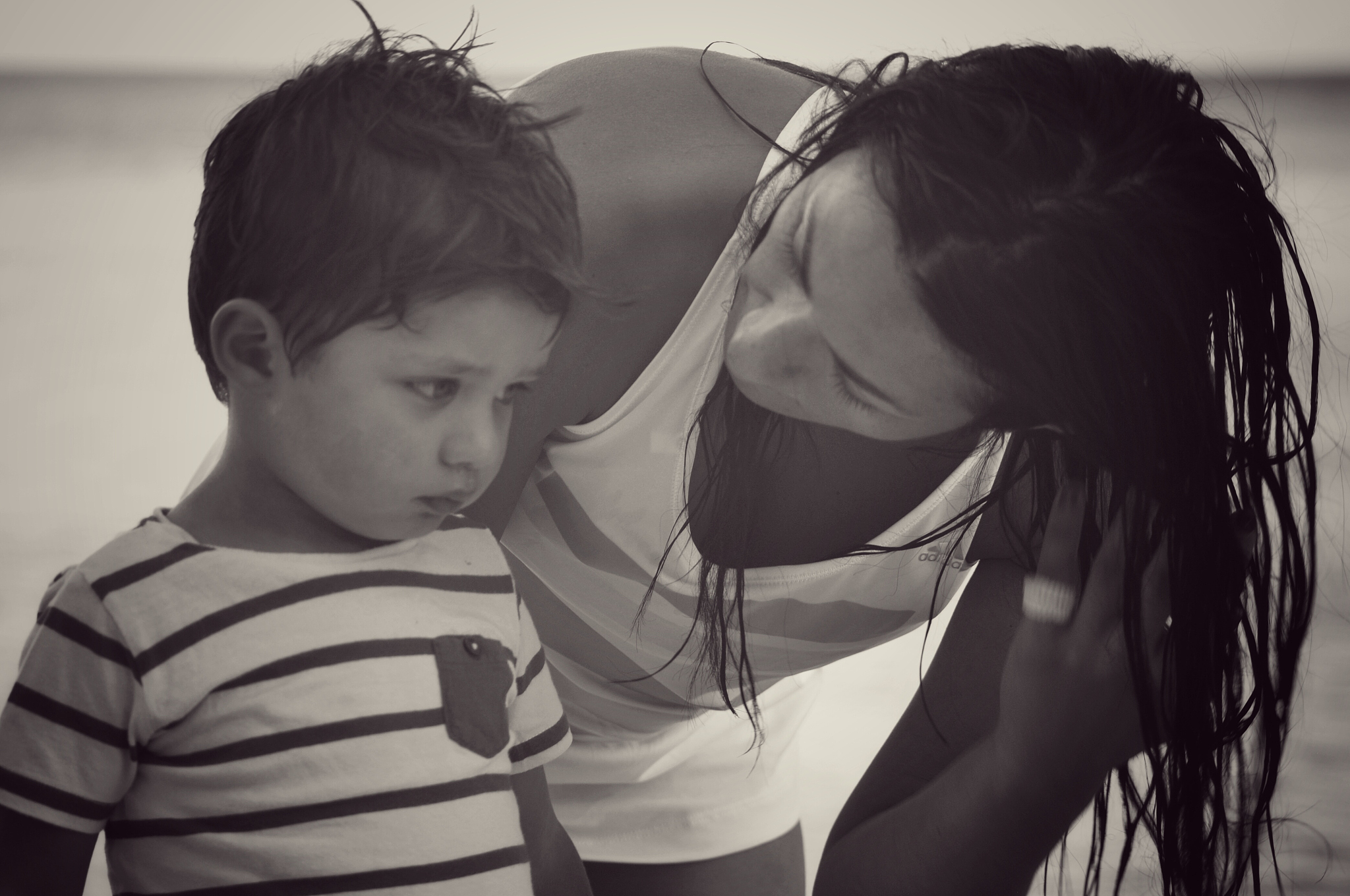 mother and cute son at beach