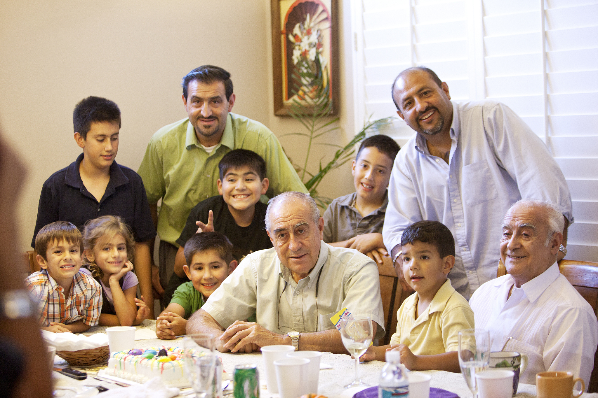 hispanic family on grandfather's birthday