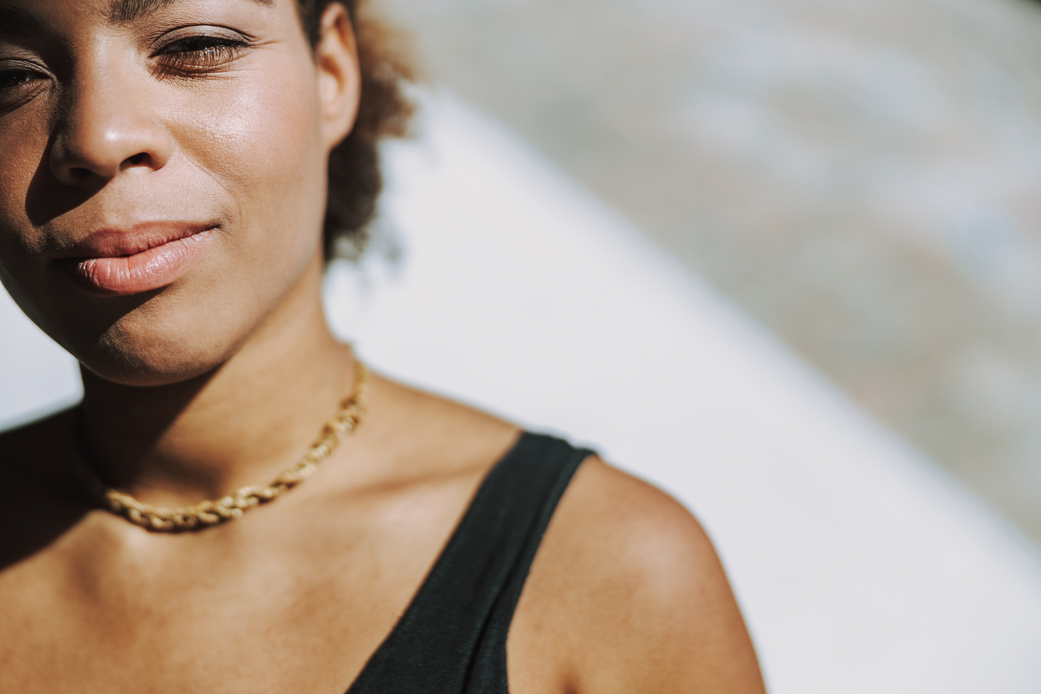 charming afro american lady looking at camera and smiling