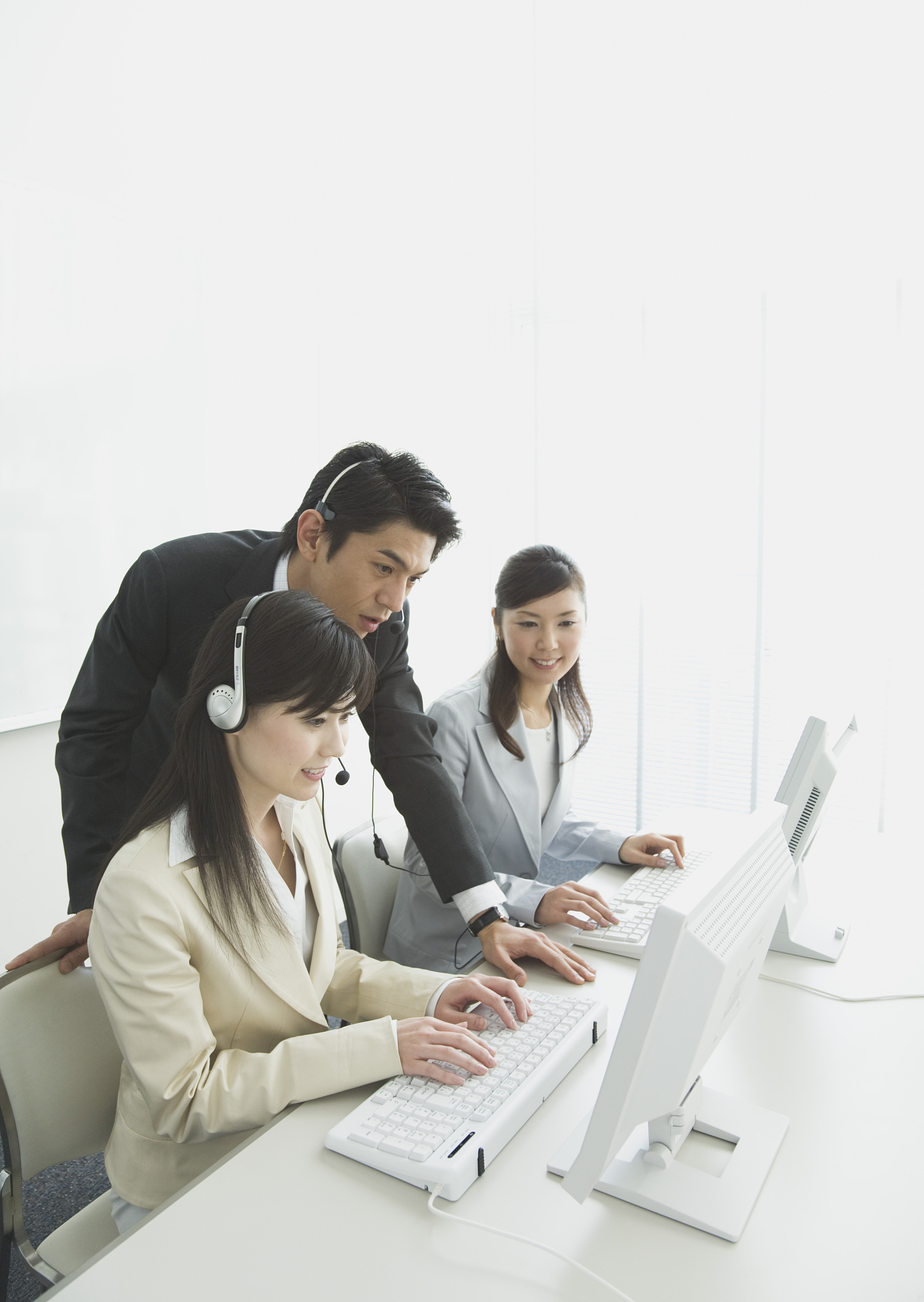operators, talking with a businessman, working in the office