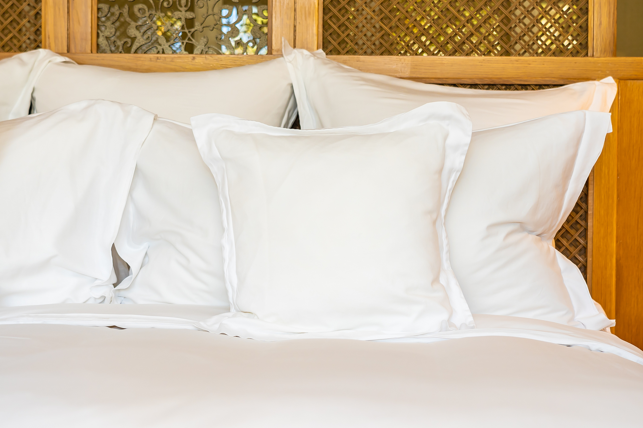 comfortable white pillow on bed decoration in bedroom