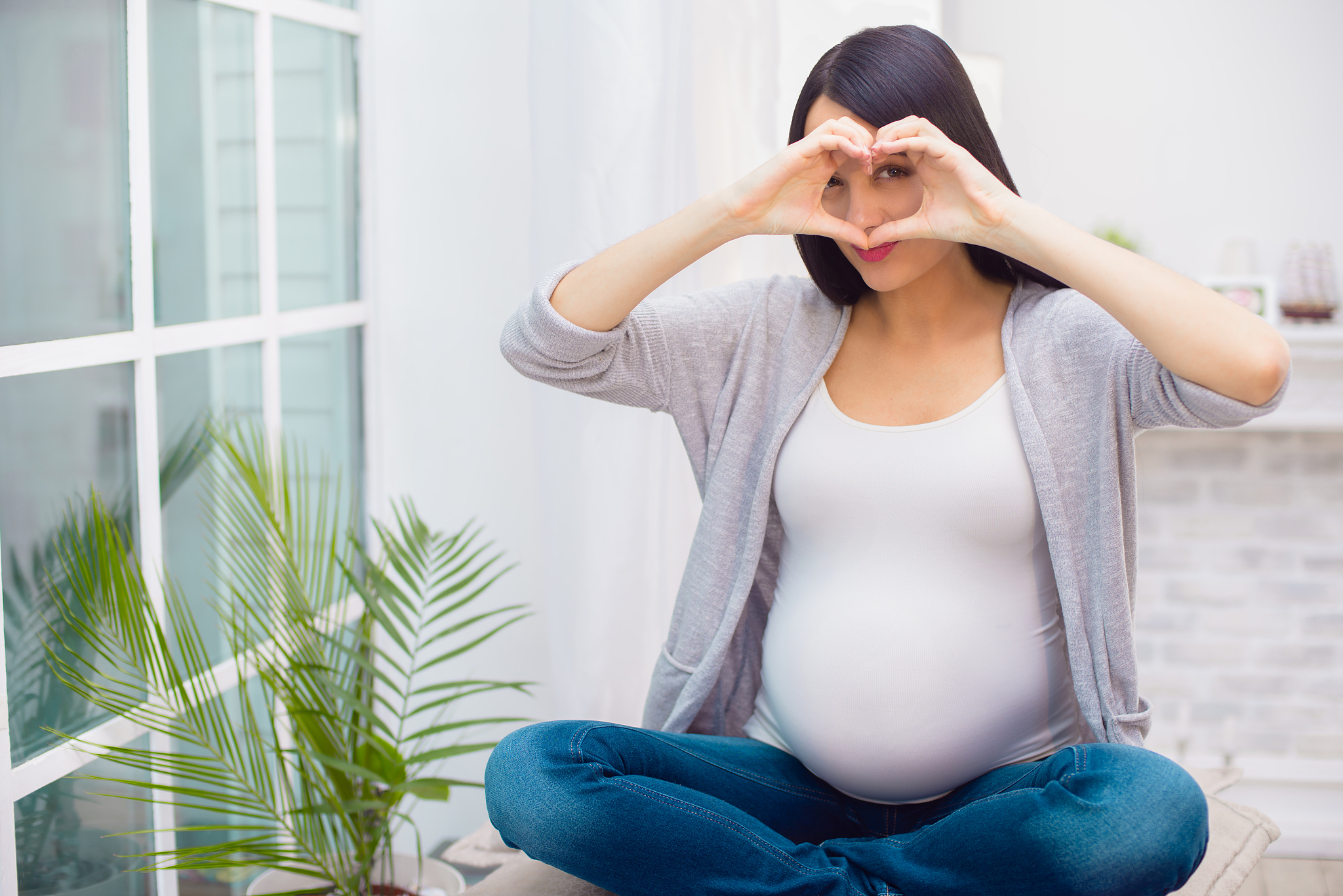 young pregnant woman at home