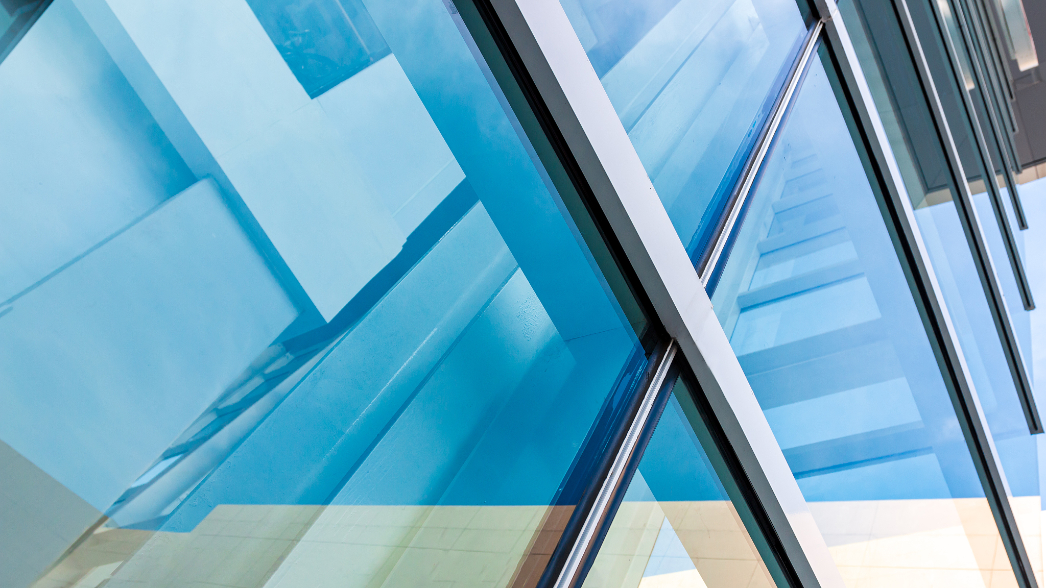 modern architecture, blue-green glass, steel structure showing m