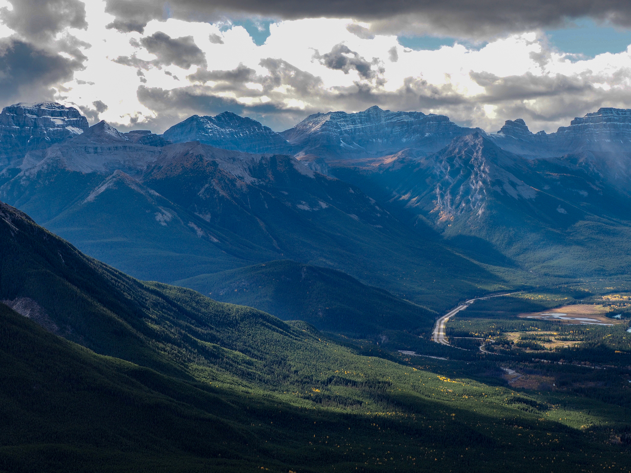 mountain view of banff national park, canada with trees and clou