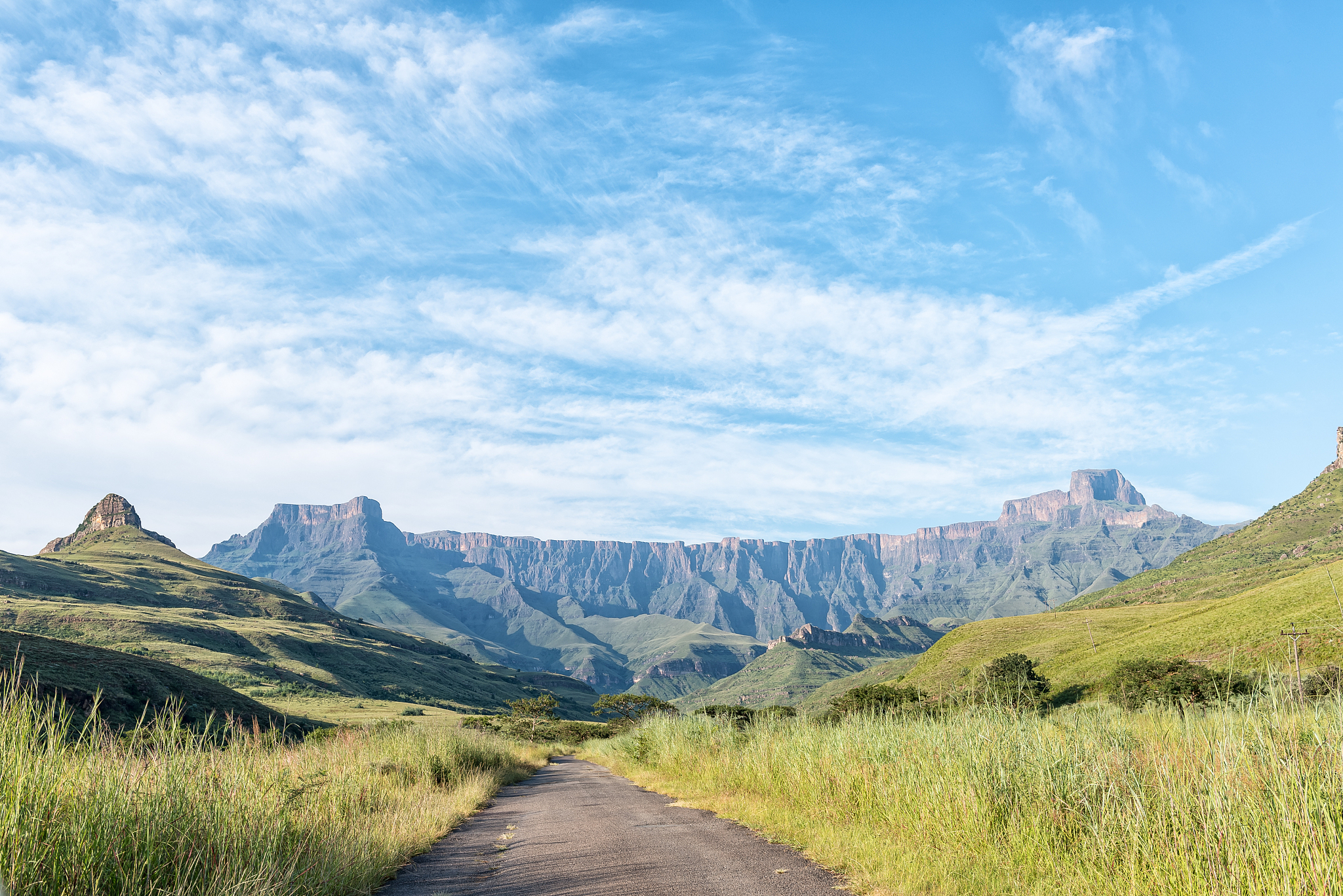 view of amphitheatre in drakensberg seen from road to thendele