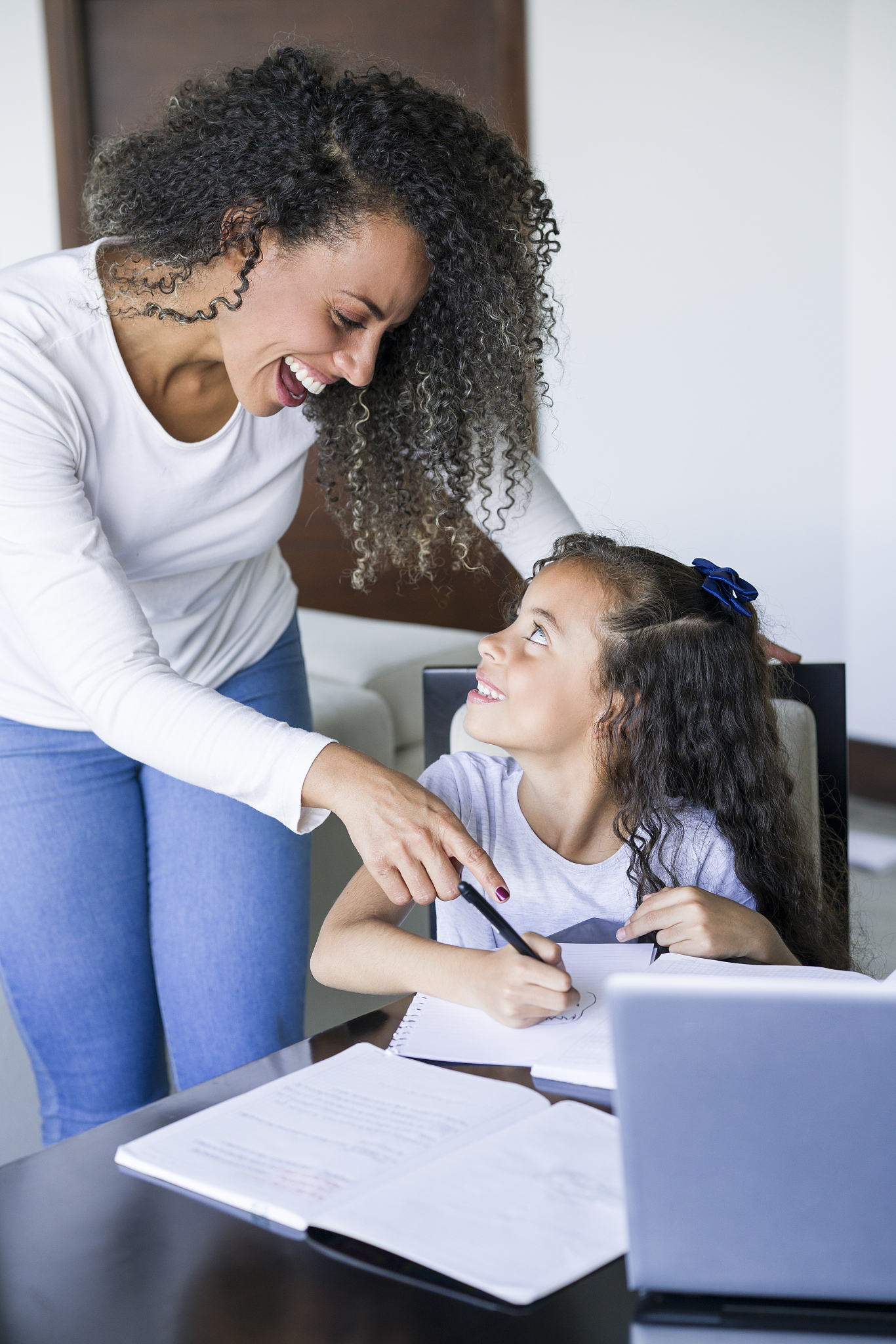 mom and daughter doing homework