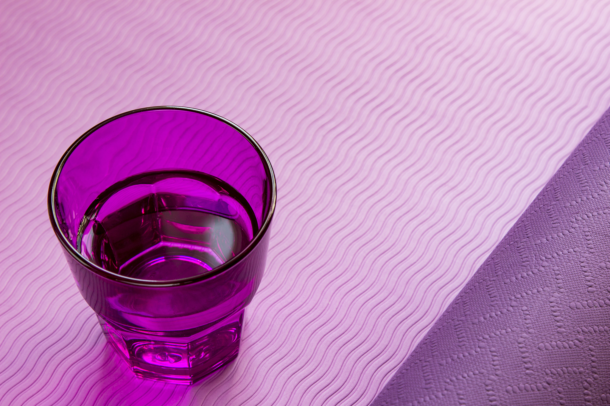 glass of water on a fitness , yoga mat. healthy lifestyle