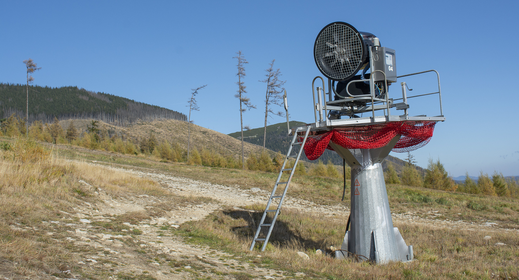 snow cannon . snow gun in summer season on ski slope.