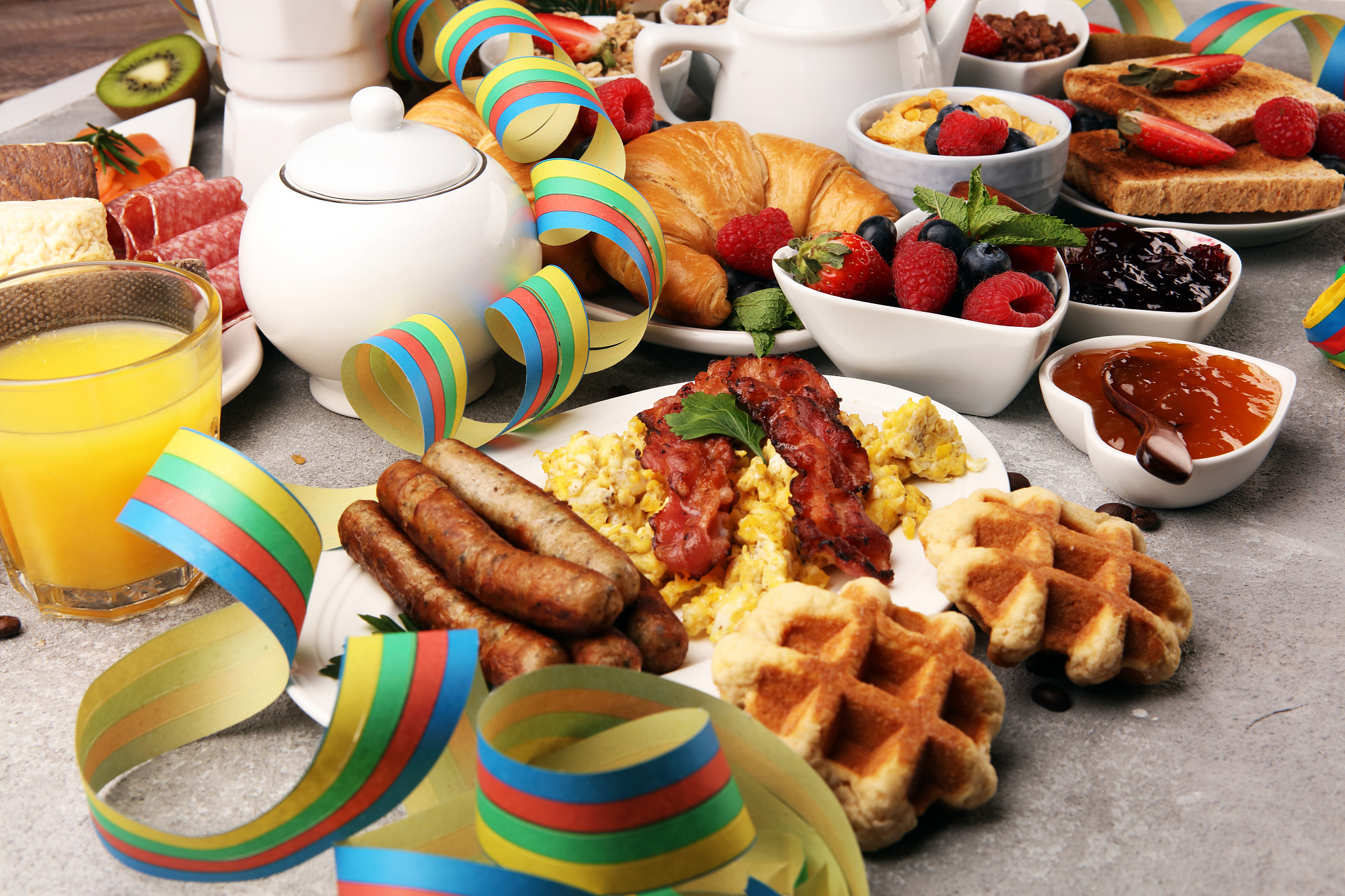 breakfast served with coffee, orange juice, croissants, cereals 